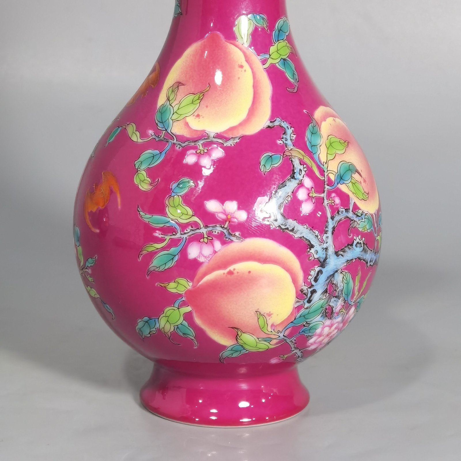 Qing Dynasty Yongzheng A pair of rouge ground pastel eight peach and five blessing vases during