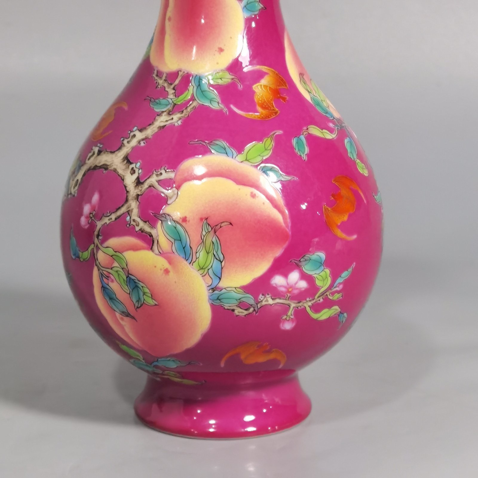 Qing Dynasty Yongzheng A pair of rouge ground pastel eight peach and five blessing vases during