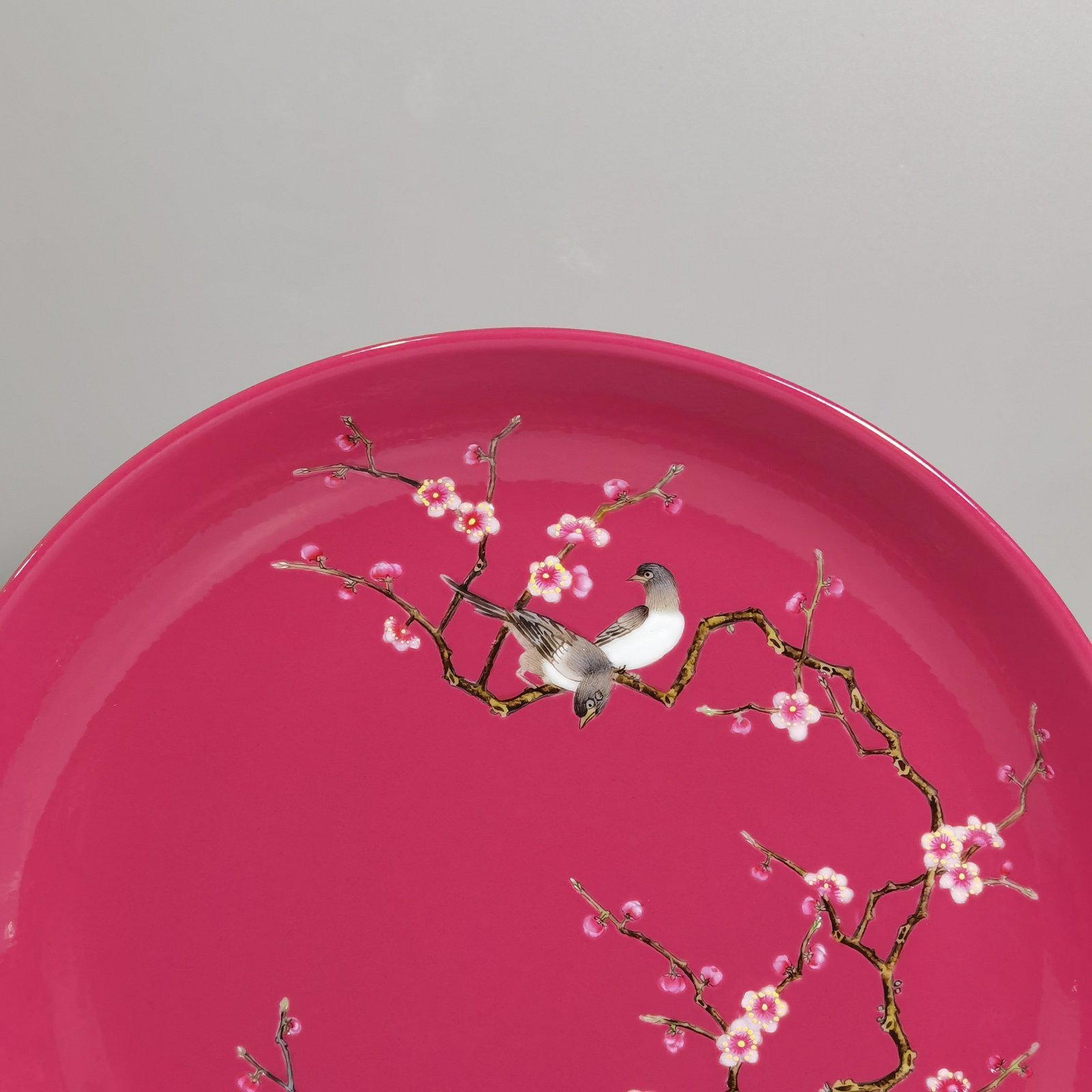 Qing Dynasty Yongzheng a pair of pink and pink magpies climbing plum blossoms on a rouge ground