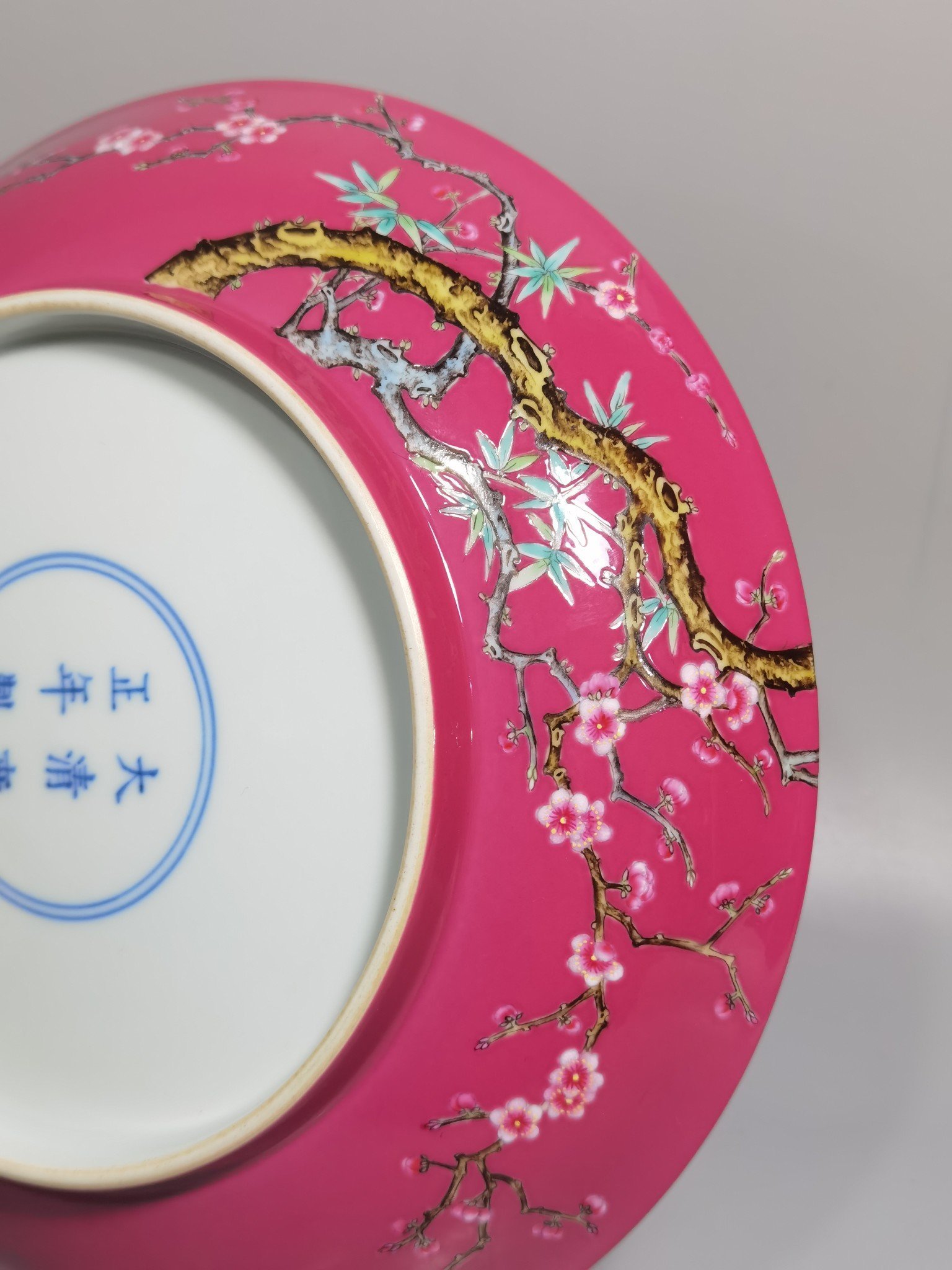 Qing Dynasty Yongzheng a pair of pink and pink magpies climbing plum blossoms on a rouge ground