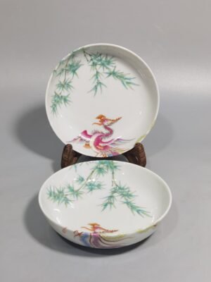 Qing Dynasty Yongzheng A pair of small platters with pastel-colored double phoenixes and green bamboo