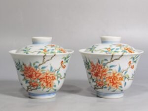 Qing Dynasty Yongzheng A pair of over-branch pastel pomegranate flower tureens