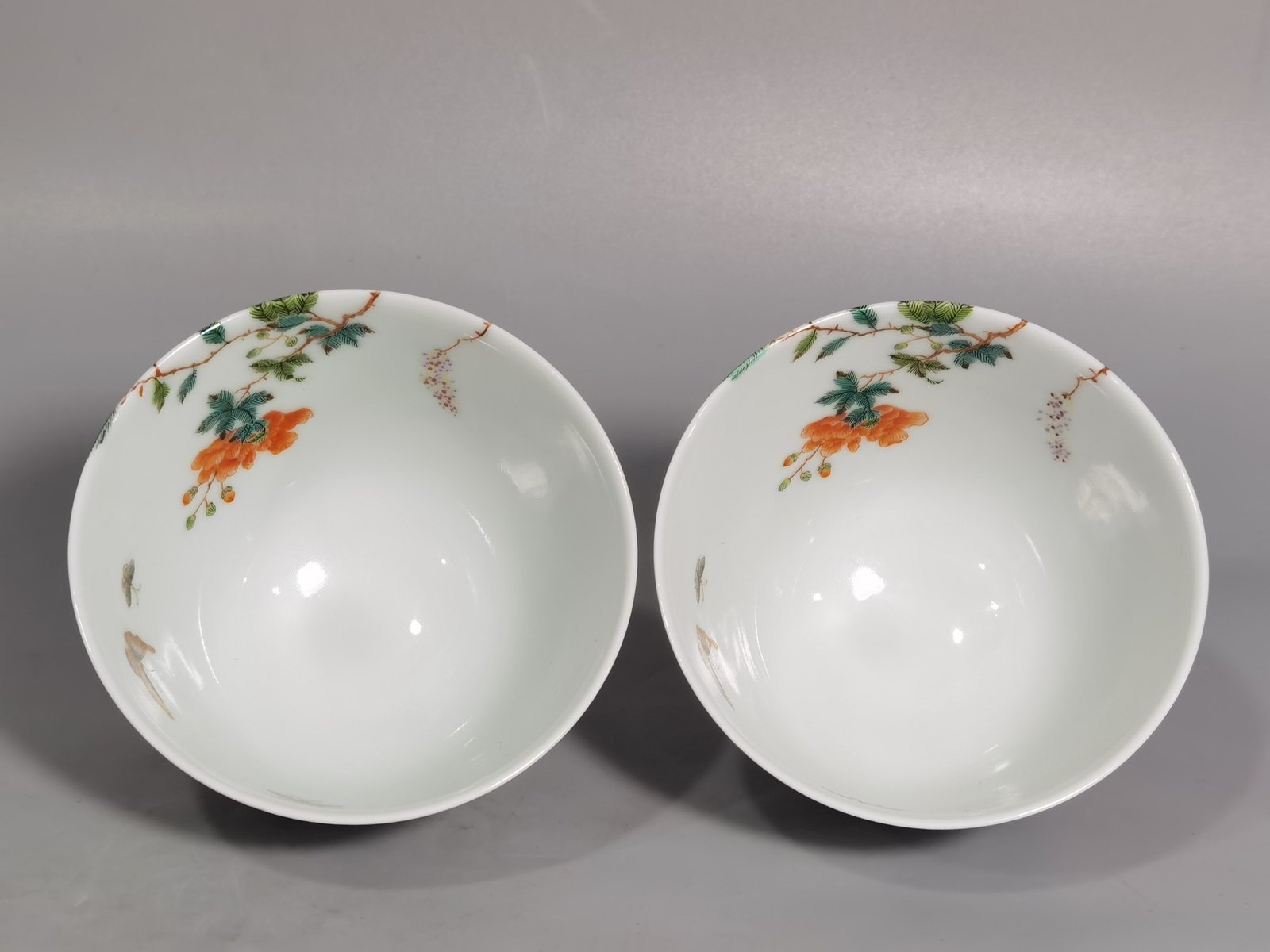 Qing Dynasty Yongzheng a pair of pastel pink butterfly and flower tea rounds