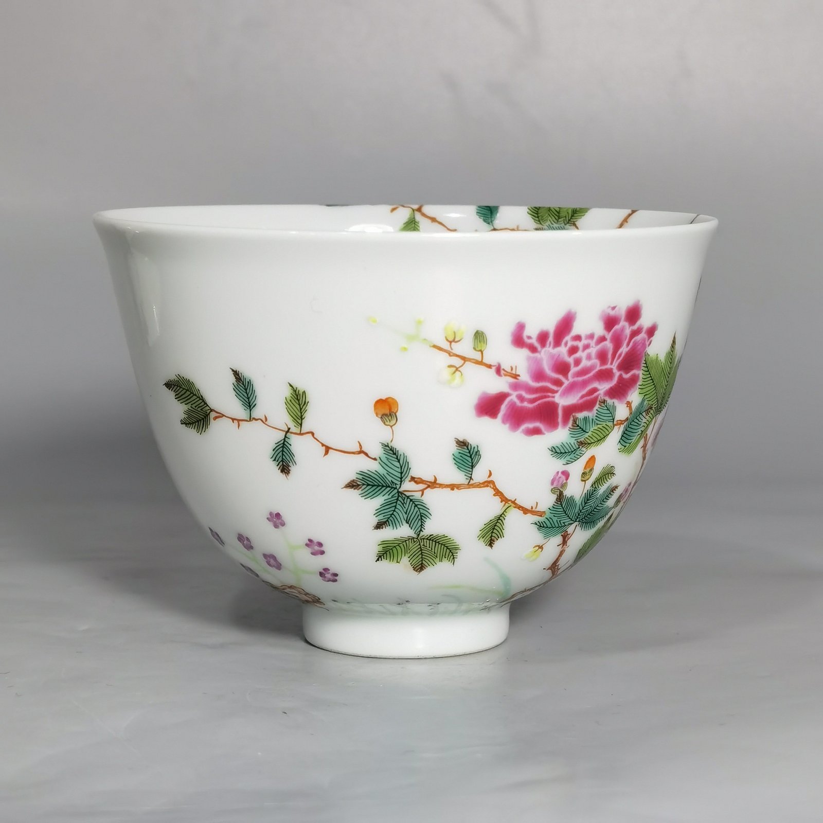 Qing Dynasty Yongzheng a pair of pastel pink butterfly and flower tea rounds