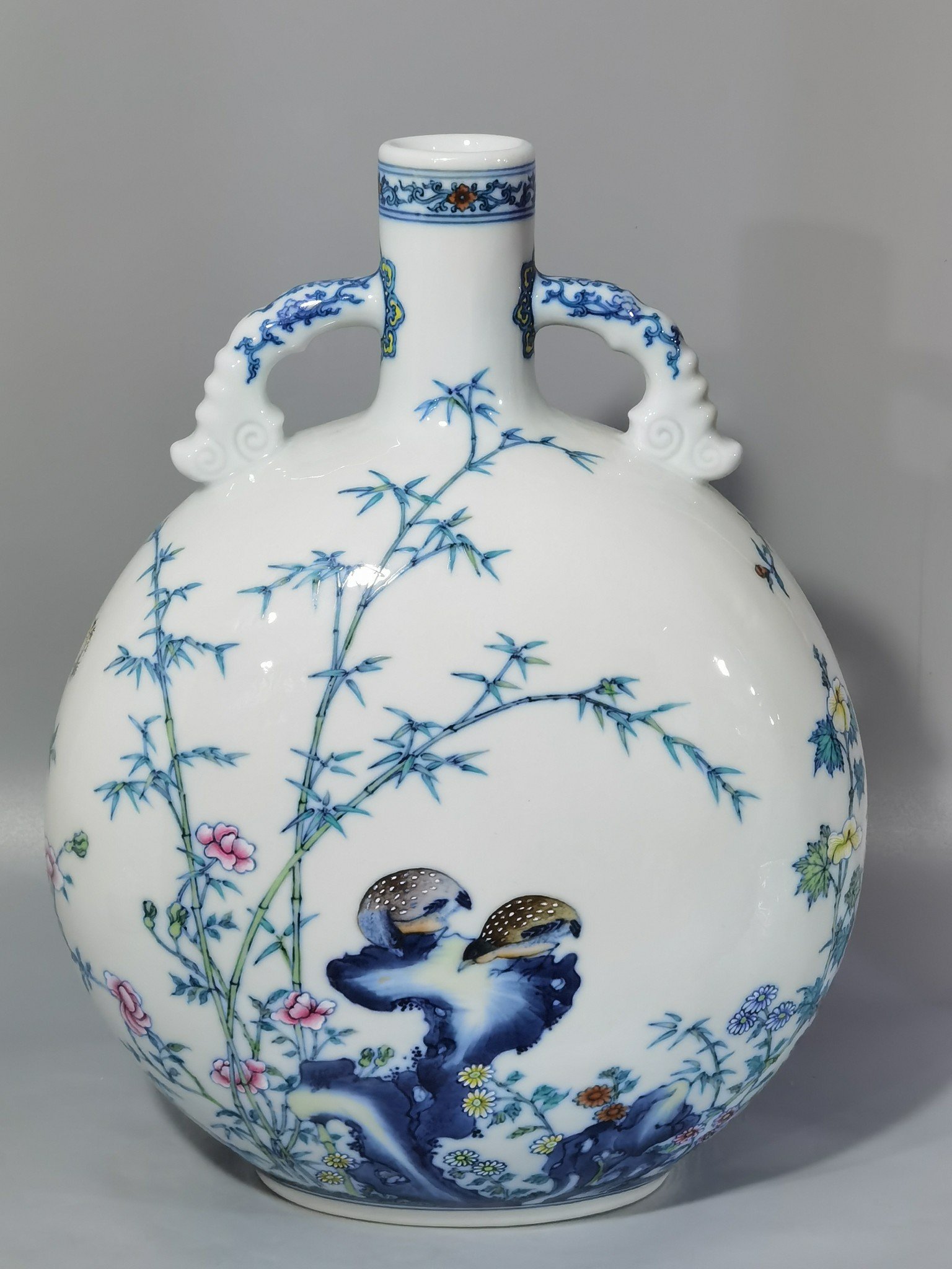 Qing Dynasty Yongzheng blue and white and pastel Anxi figure holding the moon flat vase