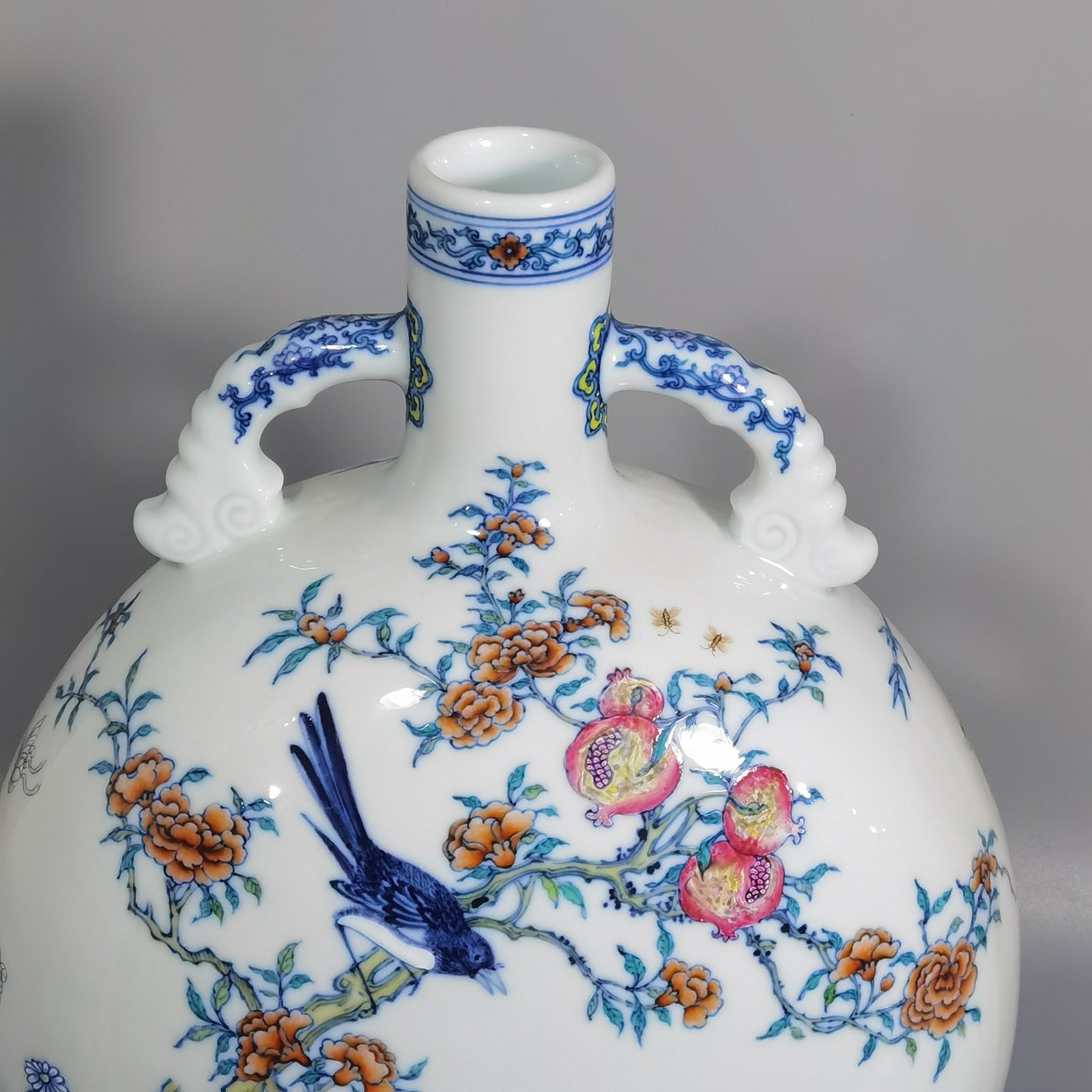 Qing Dynasty Yongzheng blue and white and pastel Anxi figure holding the moon flat vase