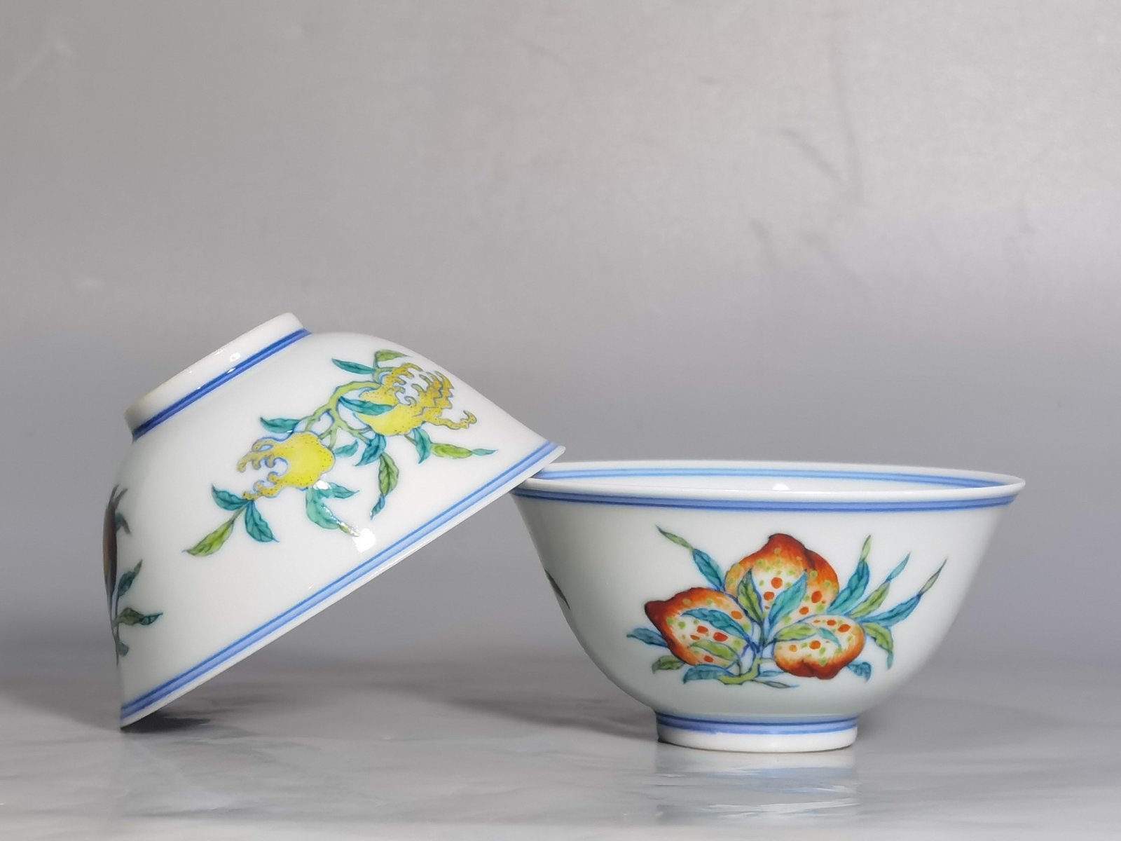 Qing Dynasty Yongzheng A pair of blue and white Doucai Sanduo pattern cups