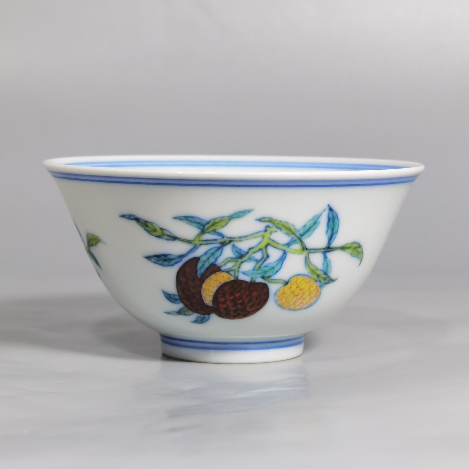Qing Dynasty Yongzheng A pair of blue and white Doucai Sanduo pattern cups