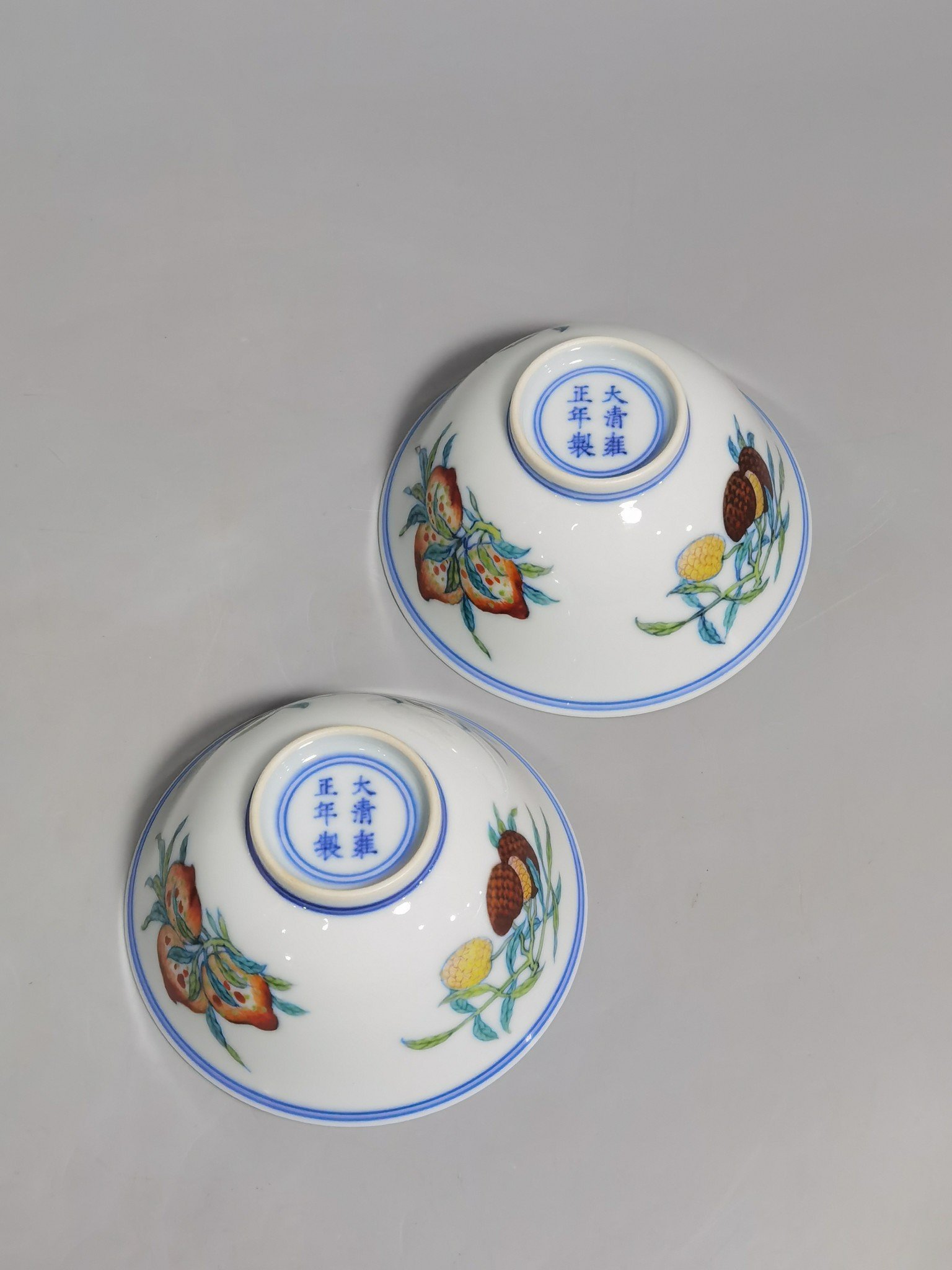 Qing Dynasty Yongzheng A pair of blue and white Doucai Sanduo pattern cups