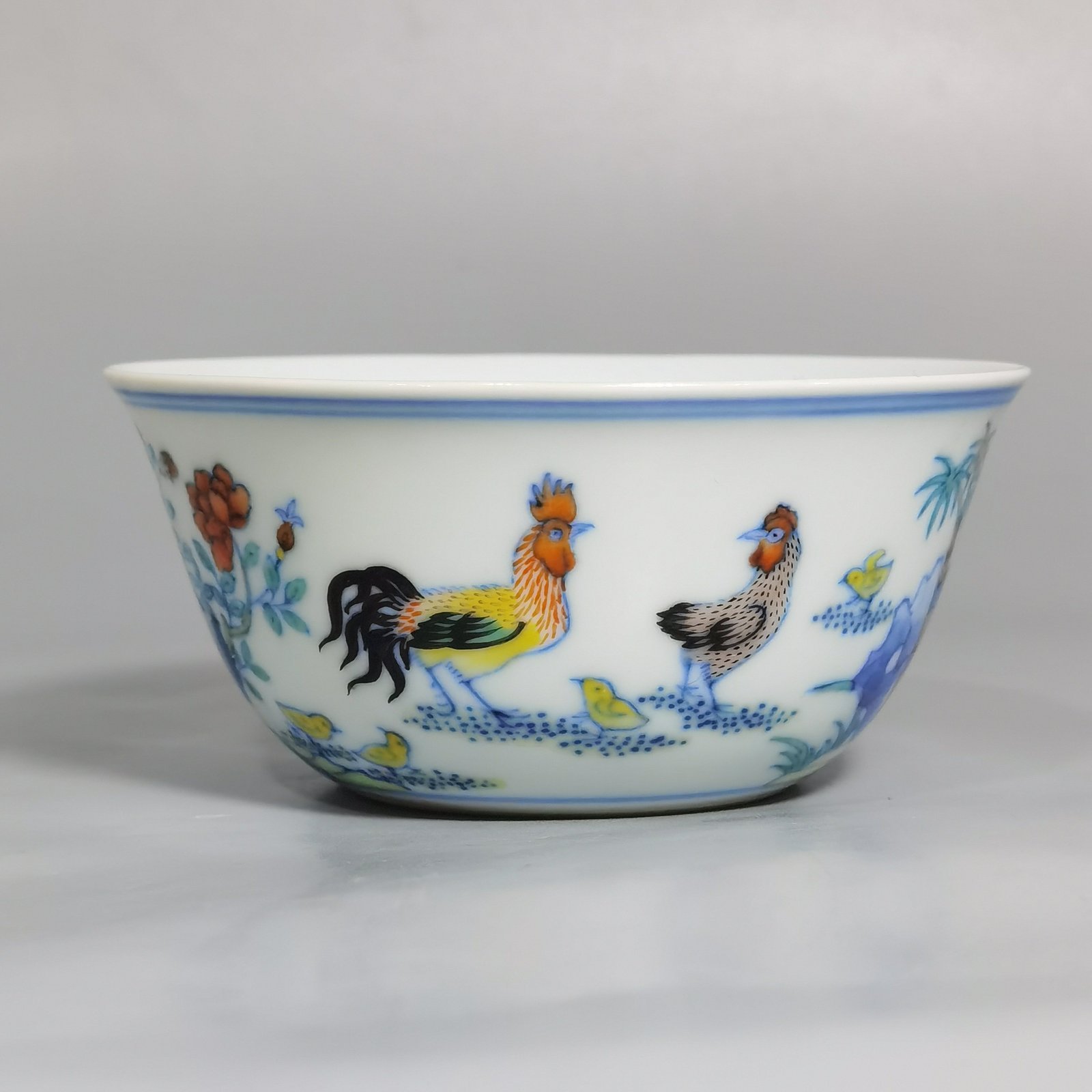 Qing Dynasty Yongzheng blue and white fighting color chicken cup