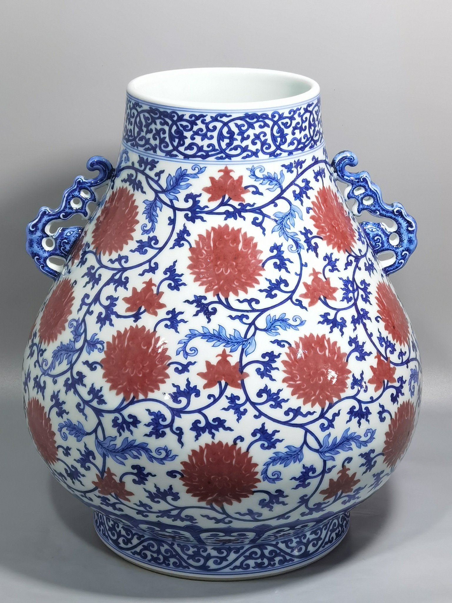 Qing Dynasty Yongzheng blue and white underglaze red lotus pattern Ruyi ear Vase