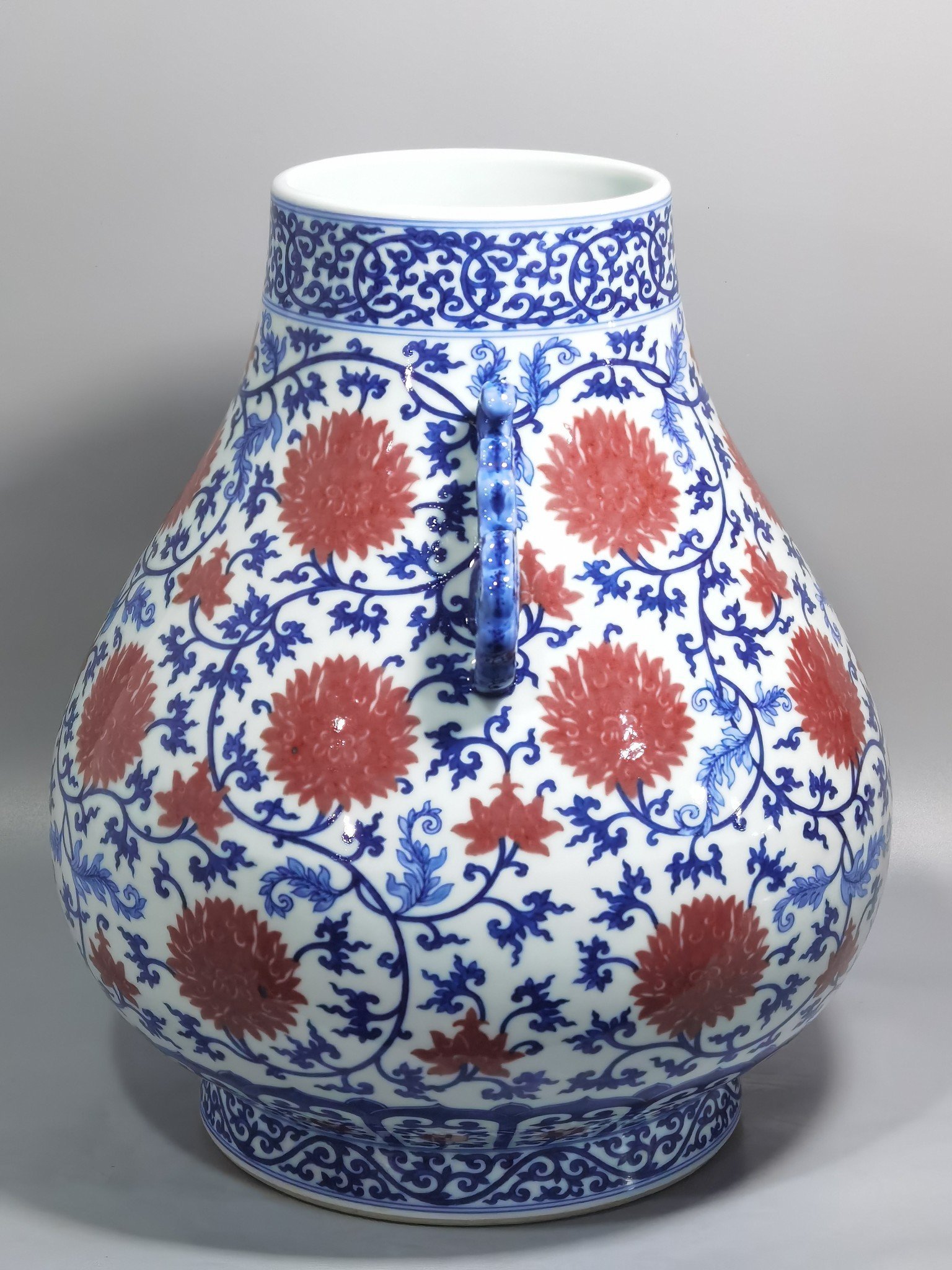 Qing Dynasty Yongzheng blue and white underglaze red lotus pattern Ruyi ear Vase