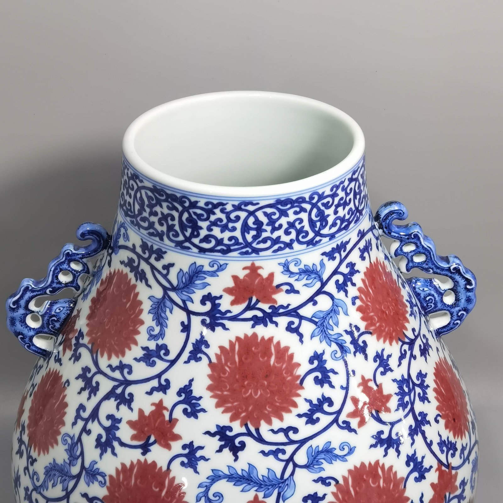 Qing Dynasty Yongzheng blue and white underglaze red lotus pattern Ruyi ear Vase
