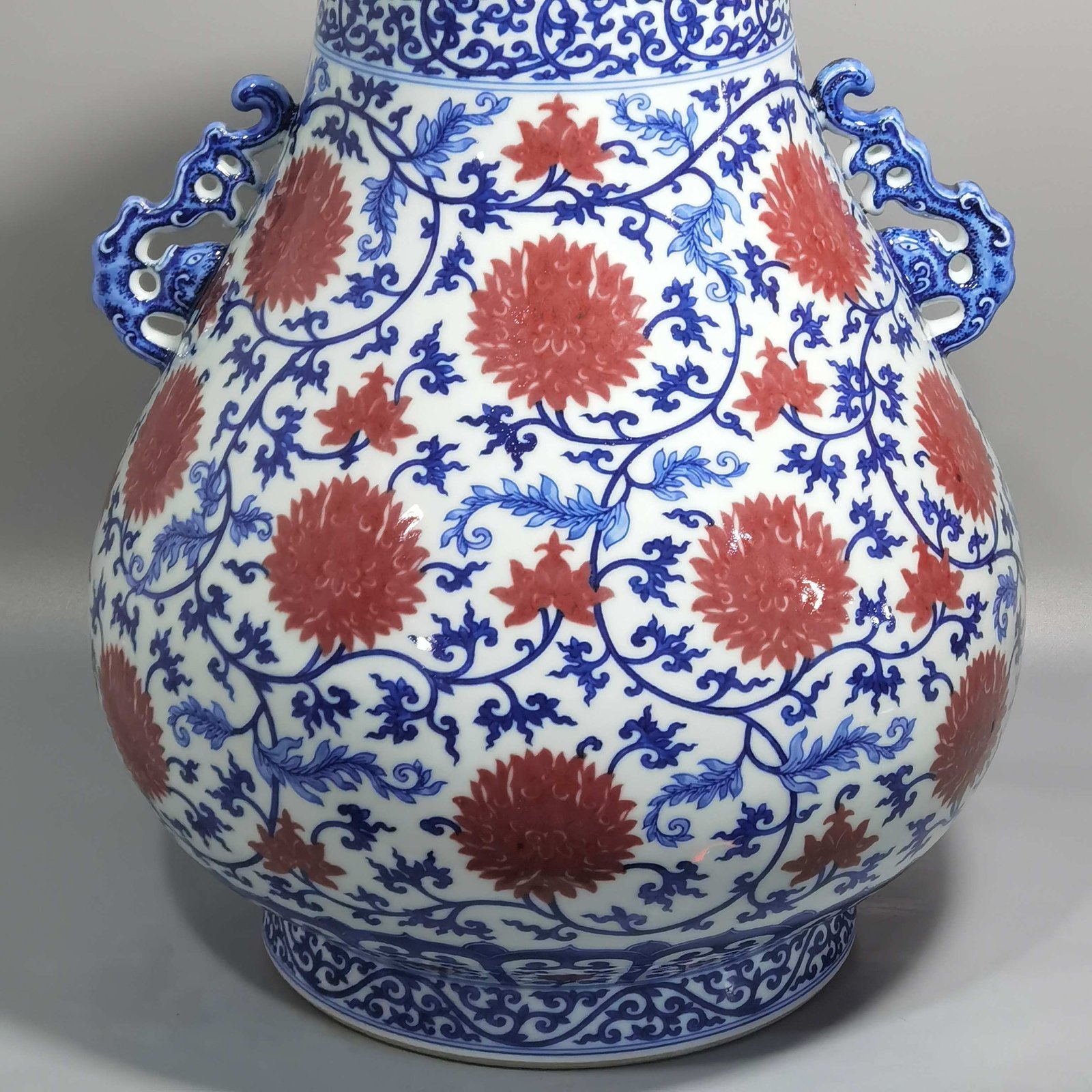 Qing Dynasty Yongzheng blue and white underglaze red lotus pattern Ruyi ear Vase