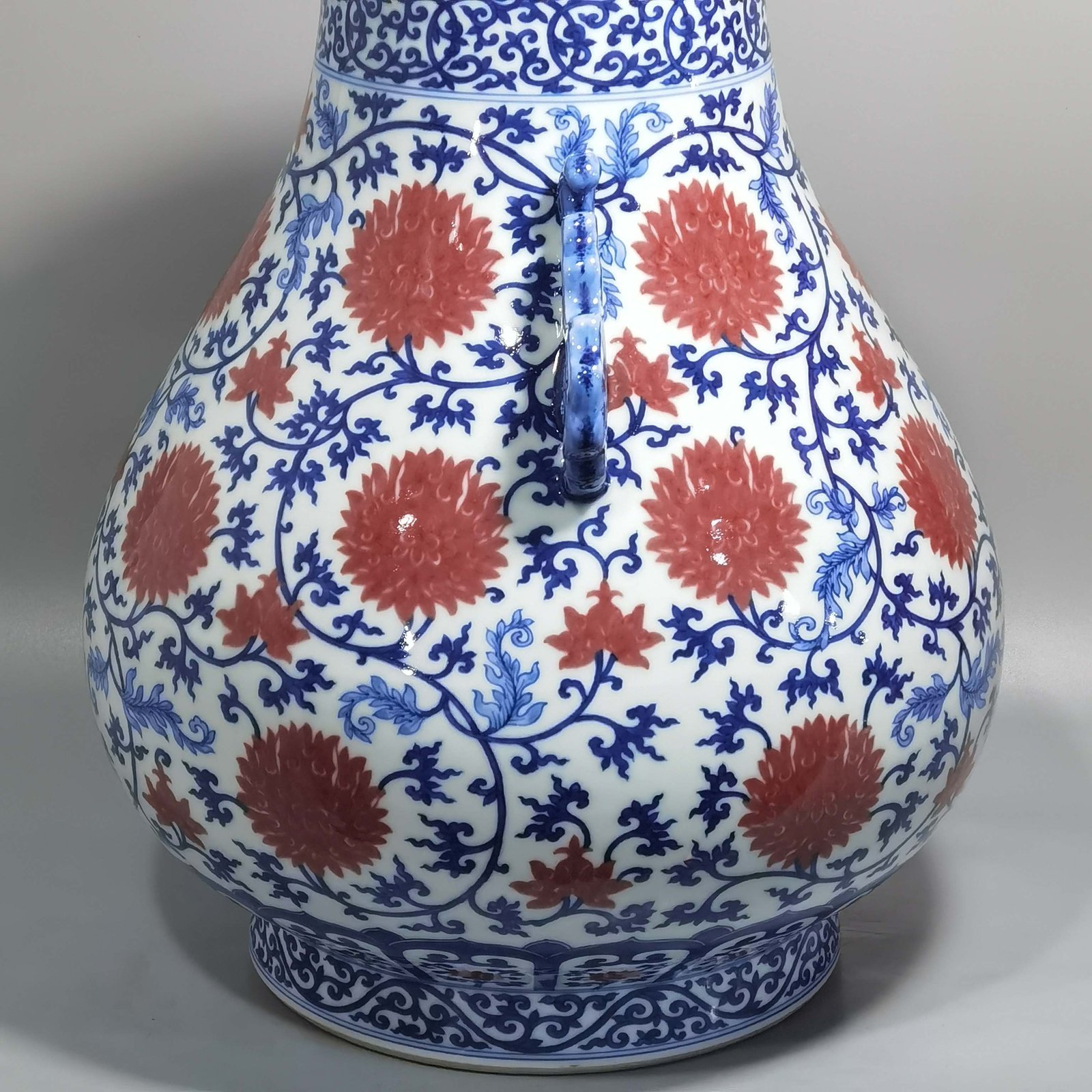 Qing Dynasty Yongzheng blue and white underglaze red lotus pattern Ruyi ear Vase