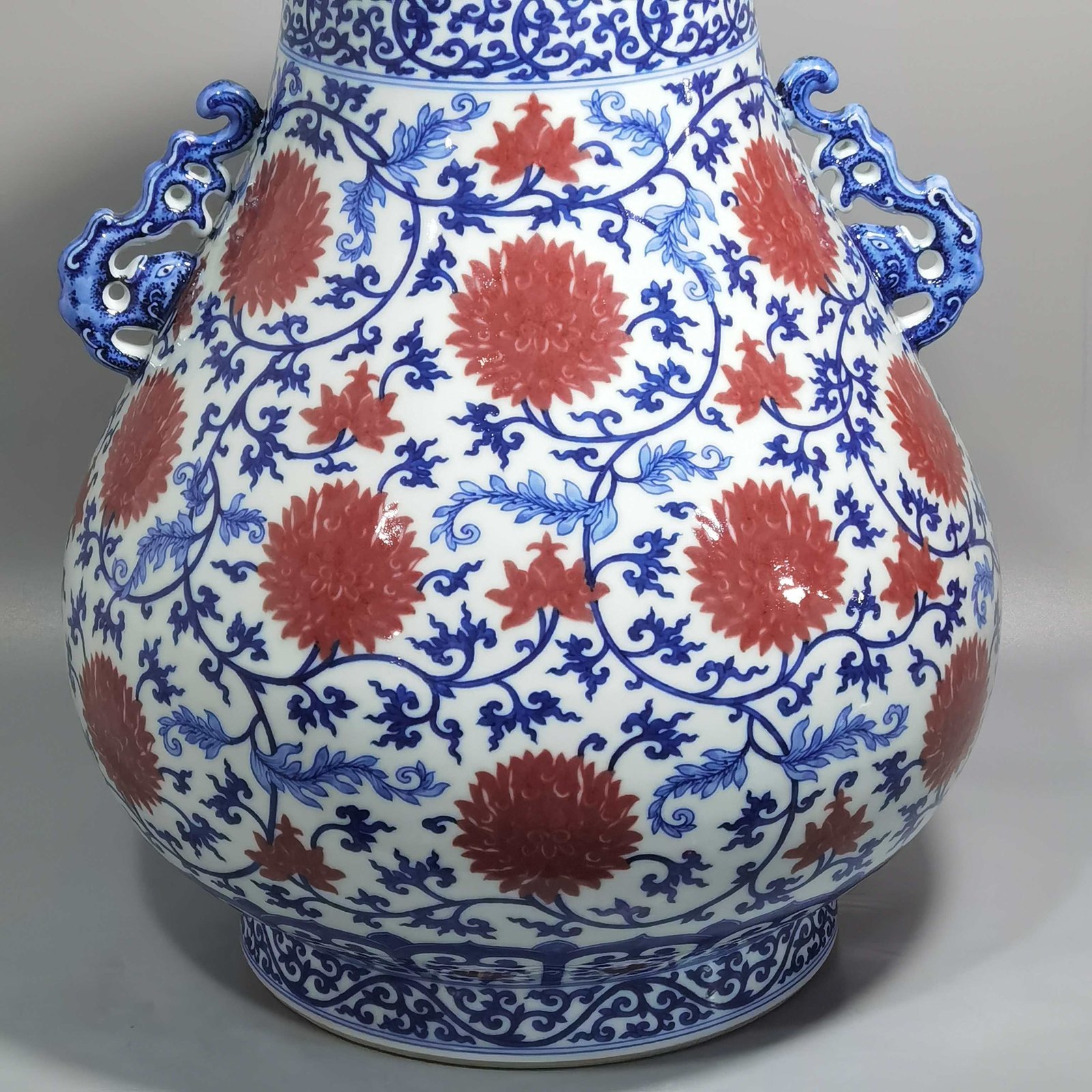 Qing Dynasty Yongzheng blue and white underglaze red lotus pattern Ruyi ear Vase