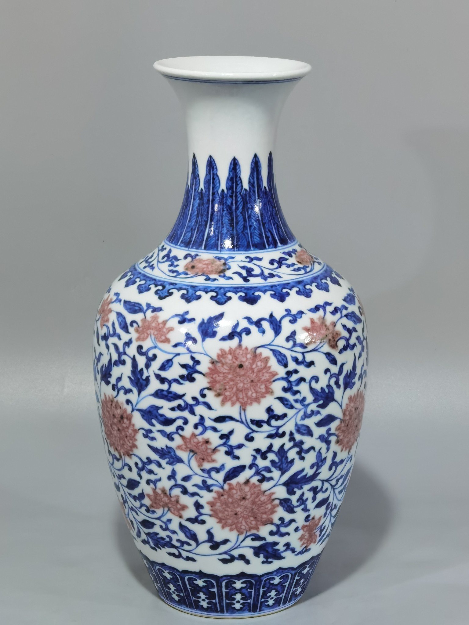 Qing Dynasty Yongzheng blue and white underglaze red lotus pattern skimming bottle