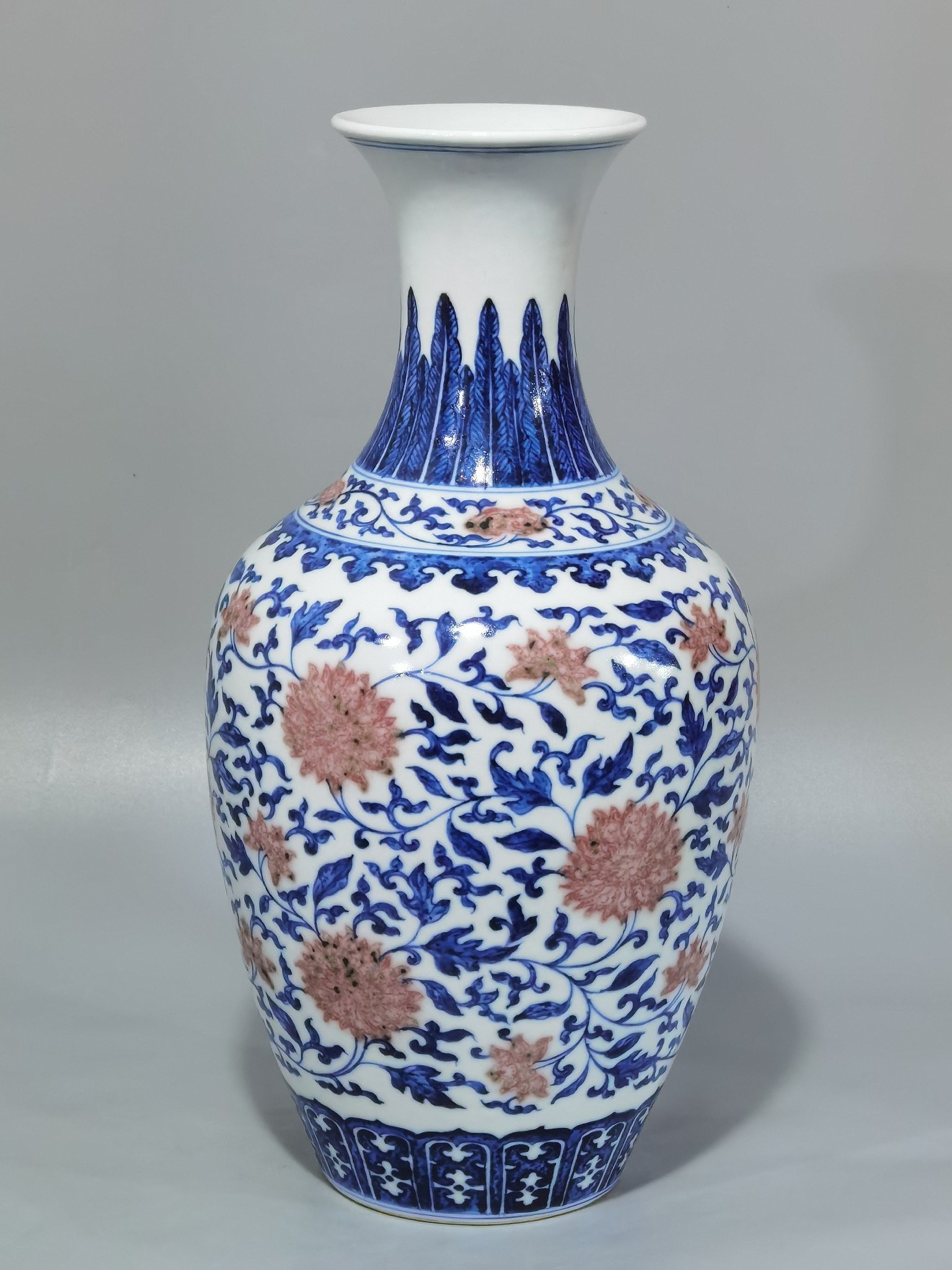 Qing Dynasty Yongzheng blue and white underglaze red lotus pattern skimming bottle