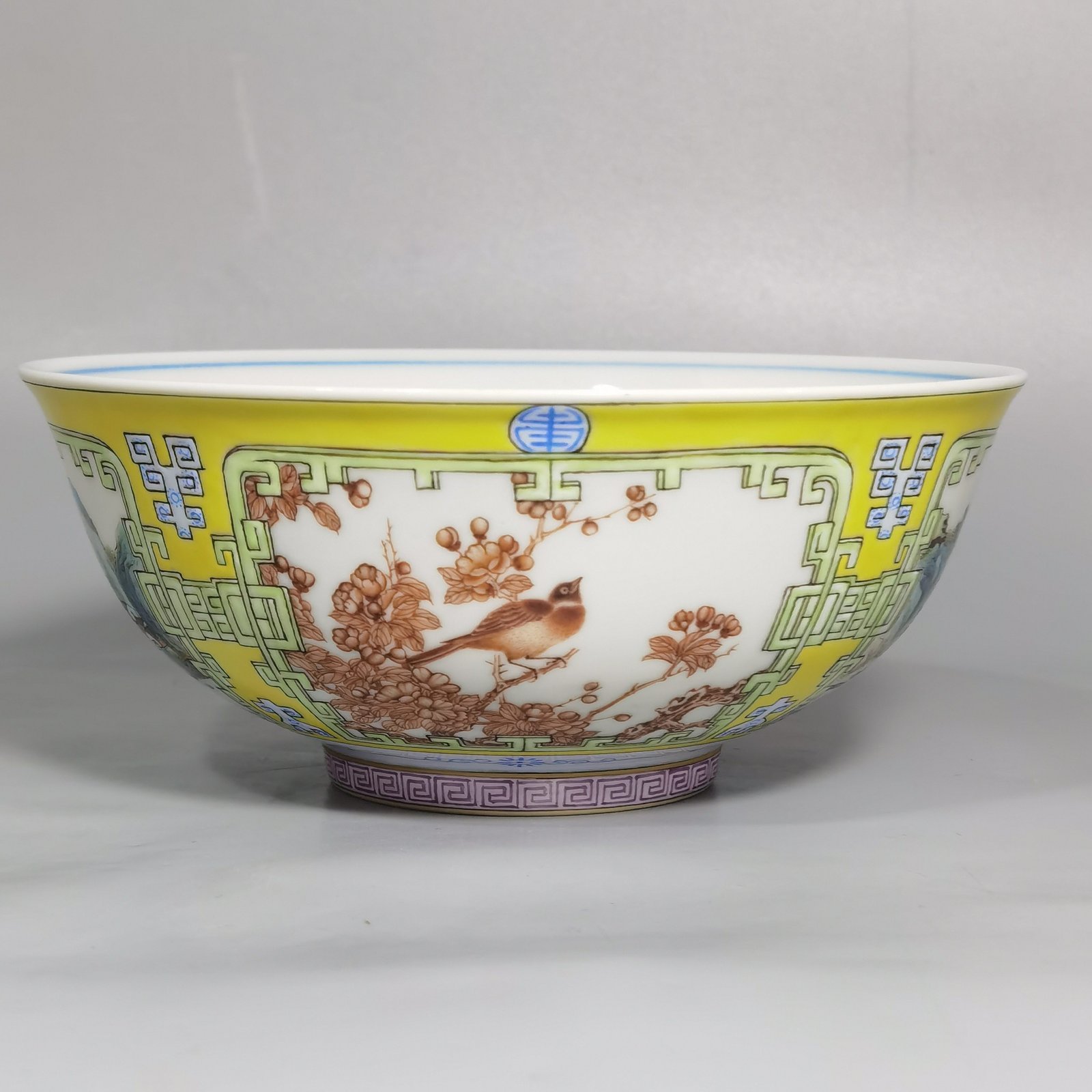 Qing Dynasty Yongzheng yellow ground pastel a pair of blue and white palace bowls with Cowherd