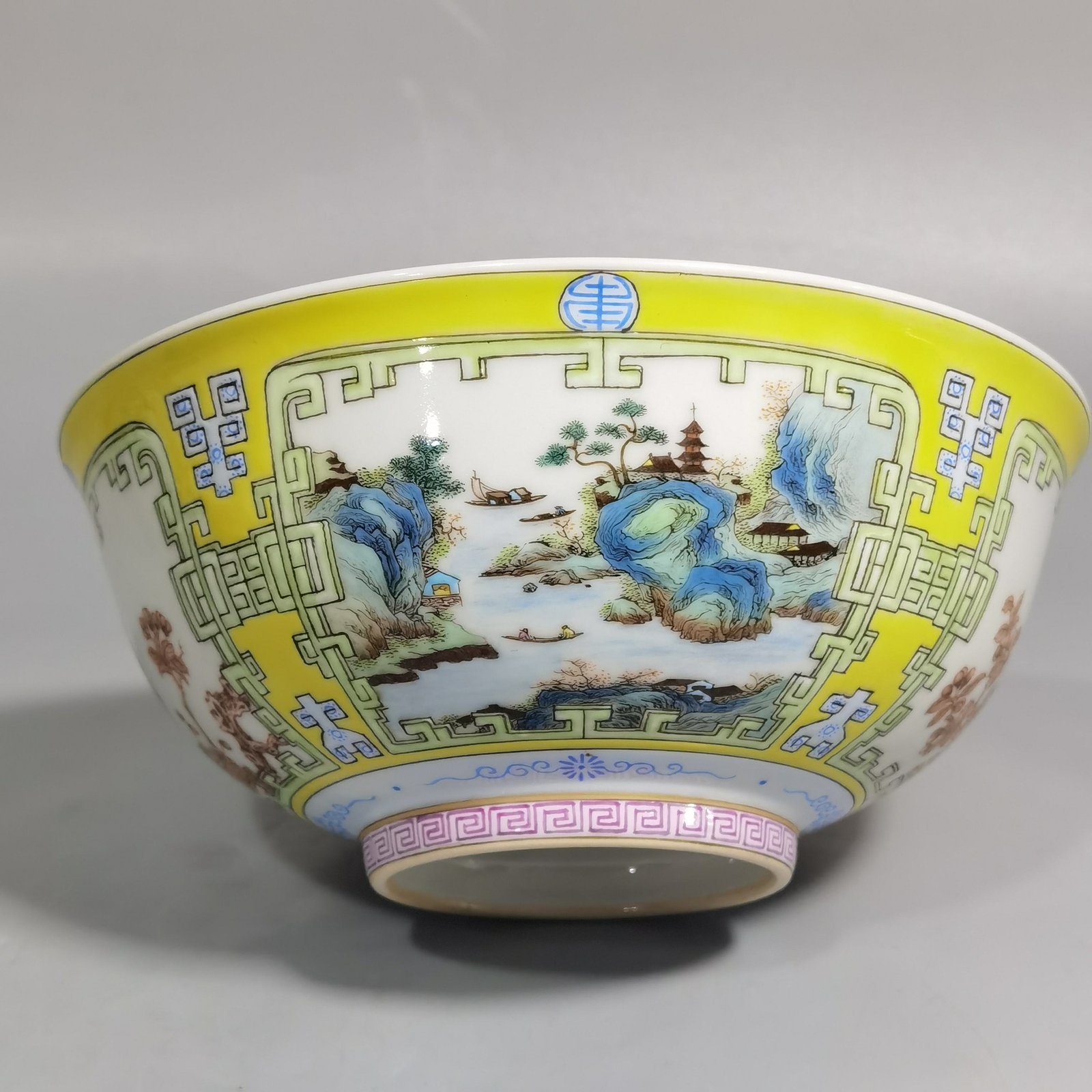 Qing Dynasty Yongzheng yellow ground pastel a pair of blue and white palace bowls with Cowherd