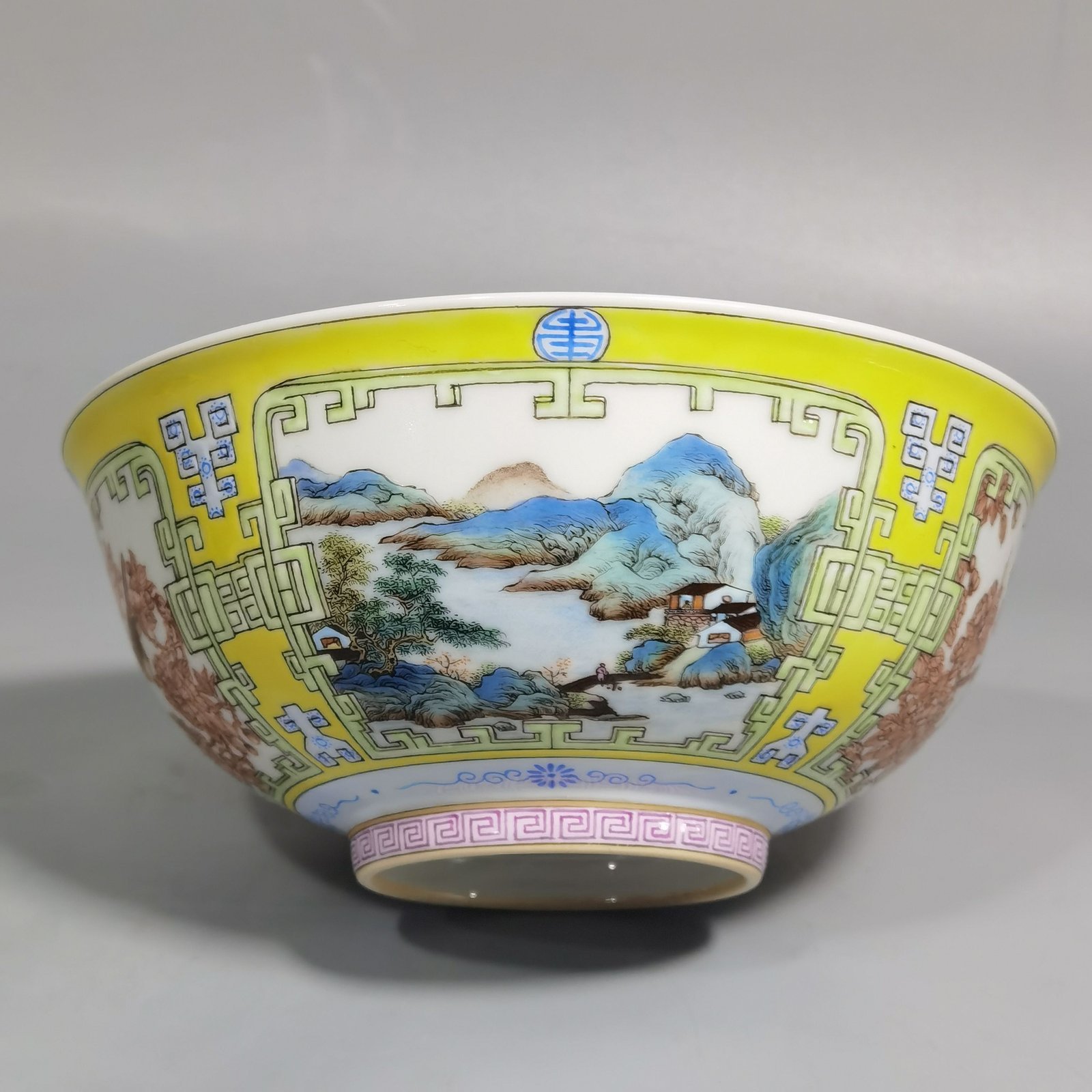 Qing Dynasty Yongzheng yellow ground pastel a pair of blue and white palace bowls with Cowherd
