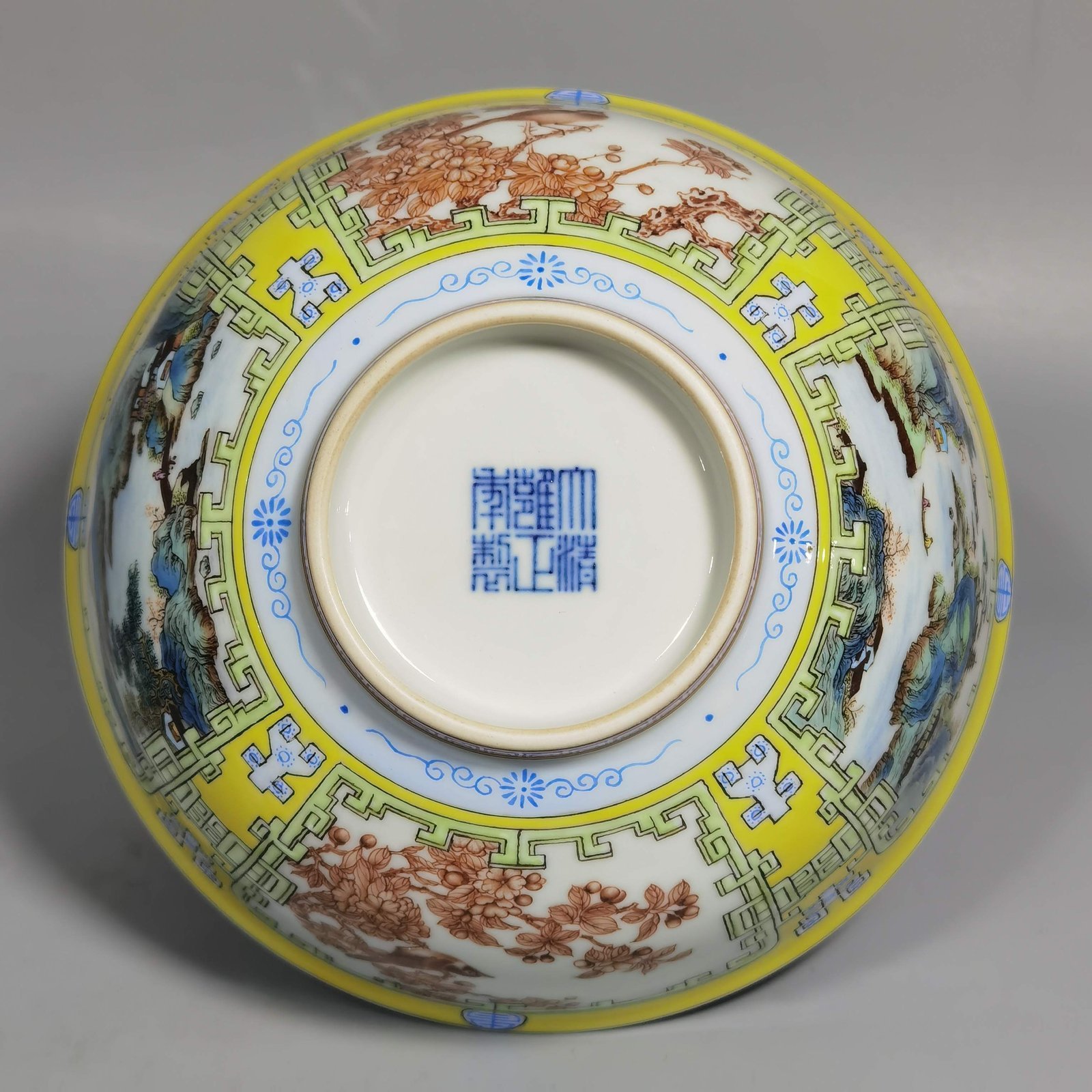 Qing Dynasty Yongzheng yellow ground pastel a pair of blue and white palace bowls with Cowherd