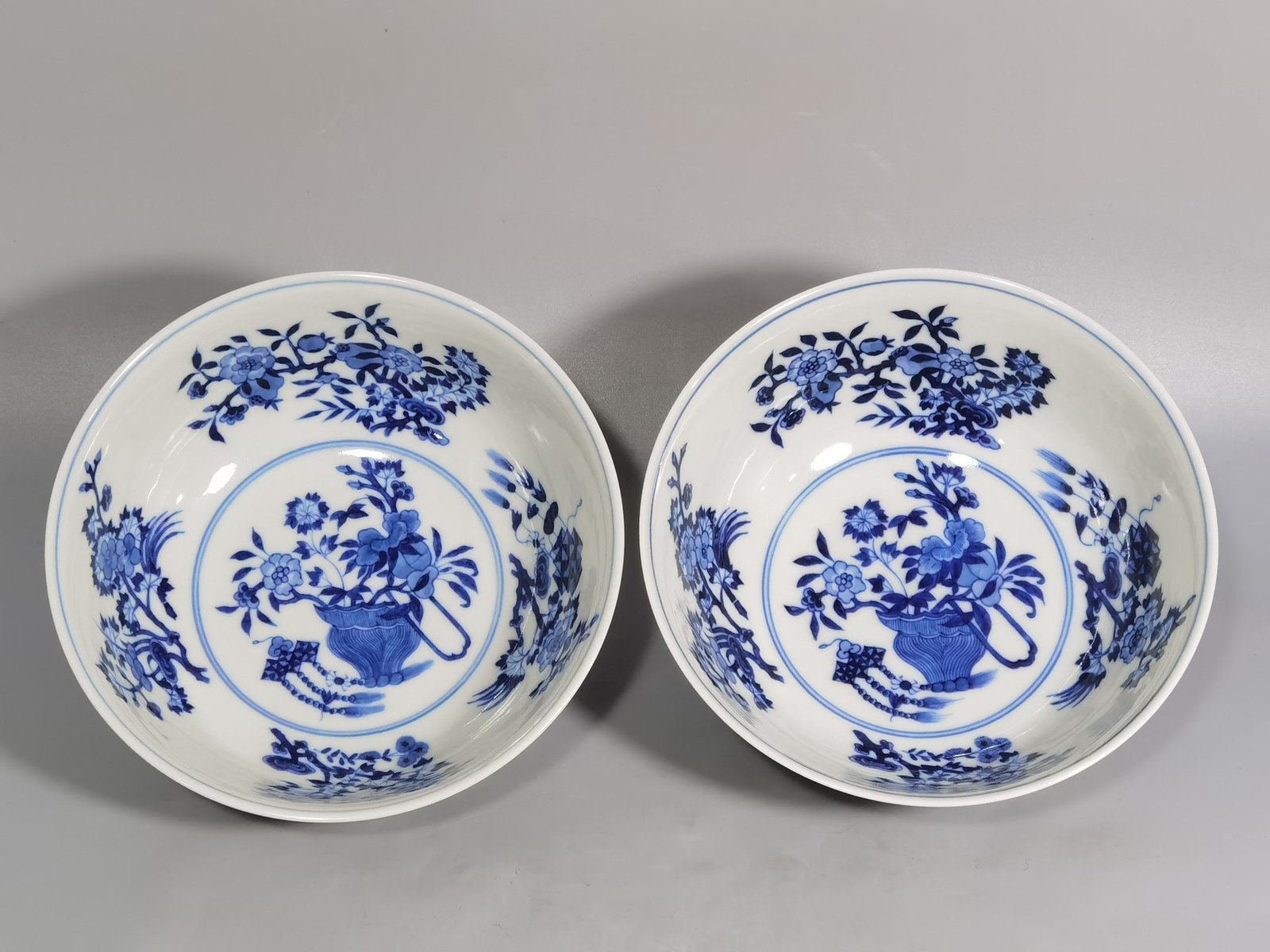 Qing Dynasty Yongzheng yellow ground pastel a pair of blue and white flower palace bowls