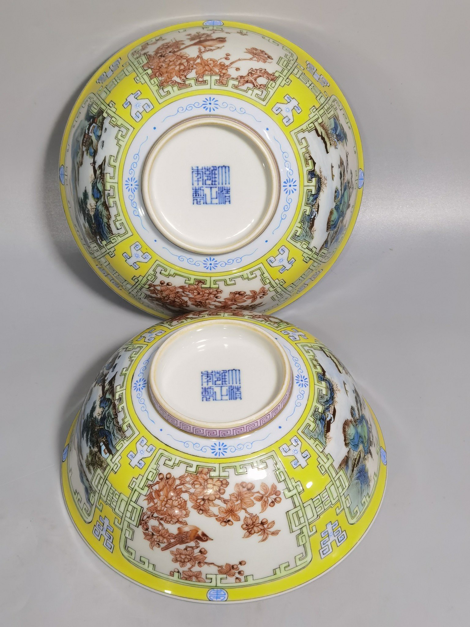Qing Dynasty Yongzheng yellow ground pastel a pair of blue and white flower palace bowls