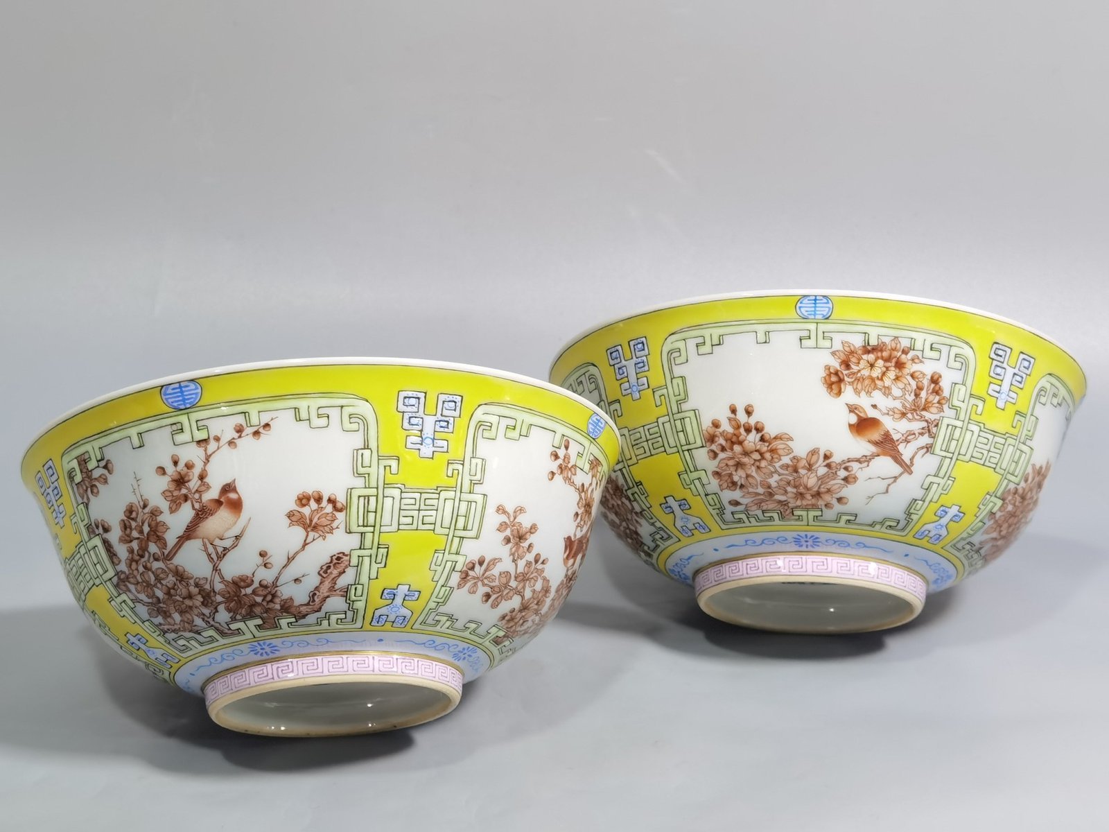 Qing Dynasty Yongzheng yellow ground pastel a pair of blue and white flower palace bowls