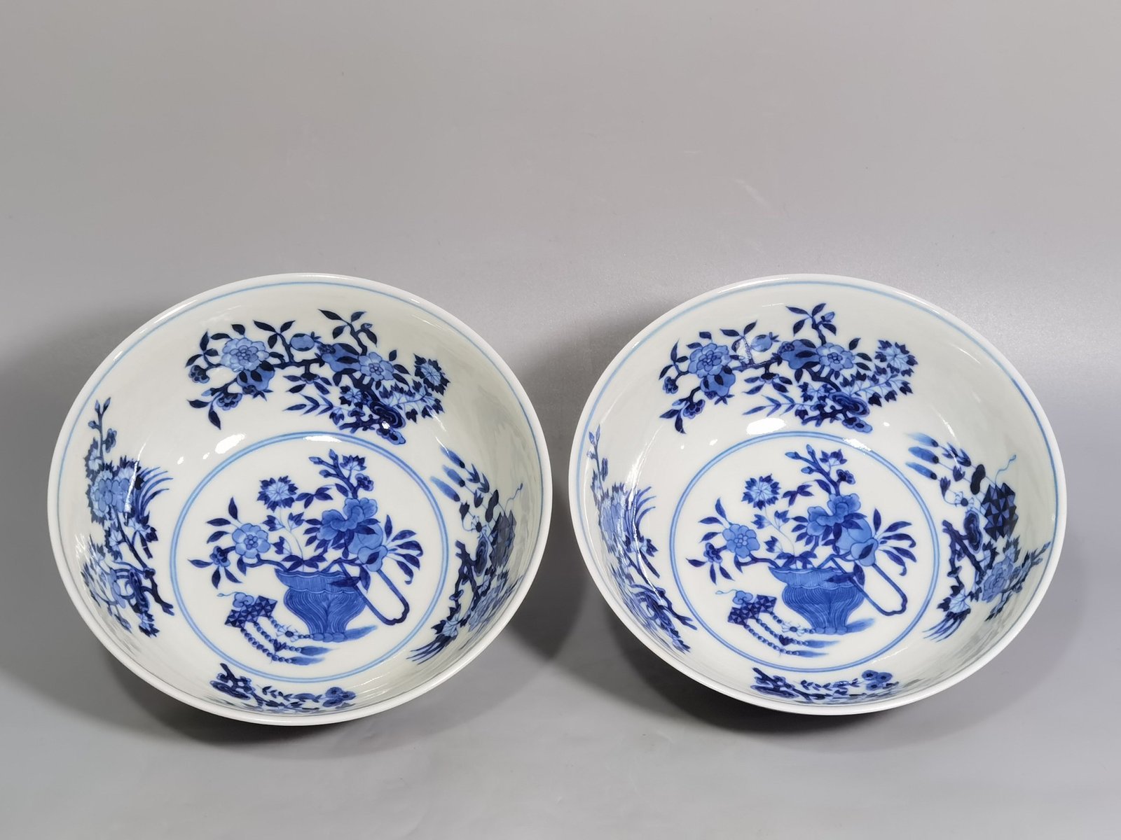 Qing Dynasty Yongzheng yellow ground pastel a pair of blue and white flower palace bowls