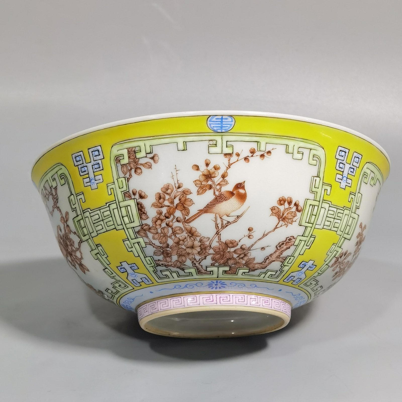 Qing Dynasty Yongzheng yellow ground pastel a pair of blue and white flower palace bowls