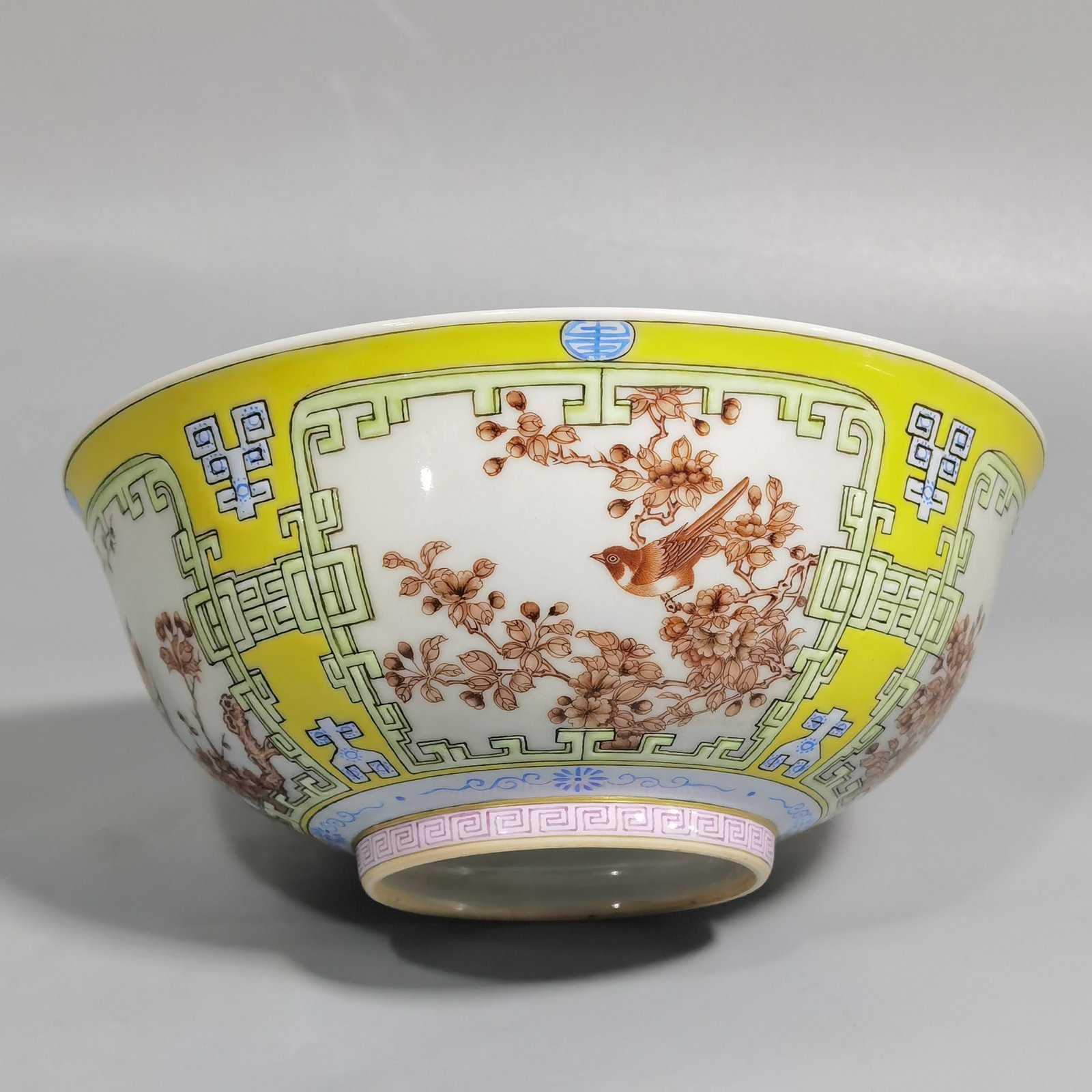 Qing Dynasty Yongzheng yellow ground pastel a pair of blue and white flower palace bowls