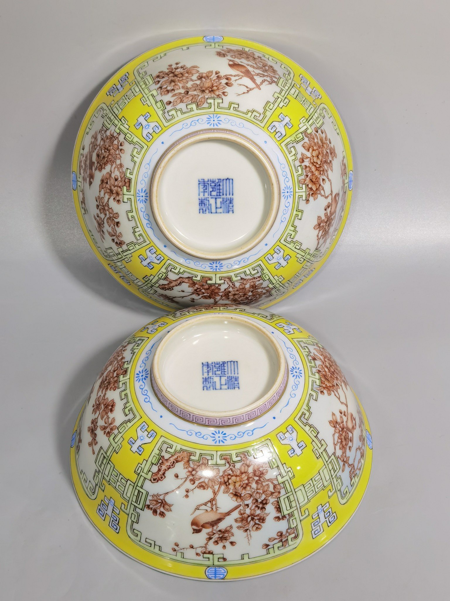 Qing Dynasty Yongzheng yellow ground pastel a pair of blue and white flower palace bowls