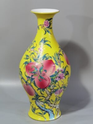 Qing Dynasty Yongzheng yellow ground rolling road pastel eight peaches and five blessings olive vase