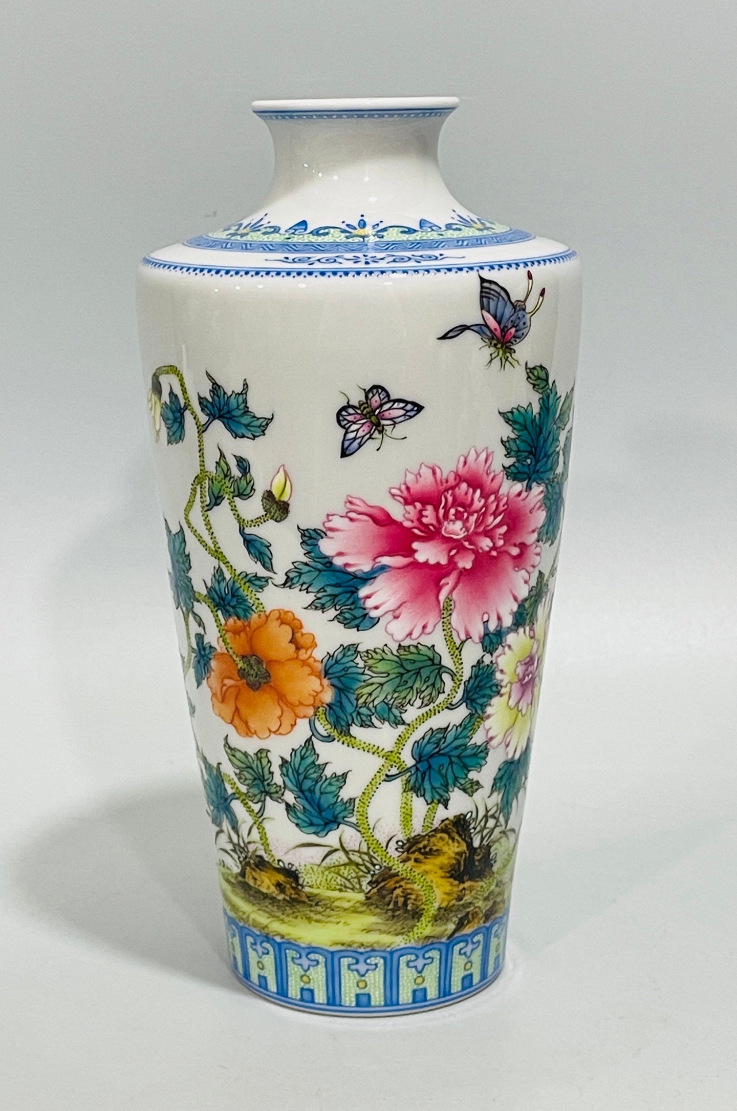 Qing Dynasty Yongzheng enamel butterfly and plum vase