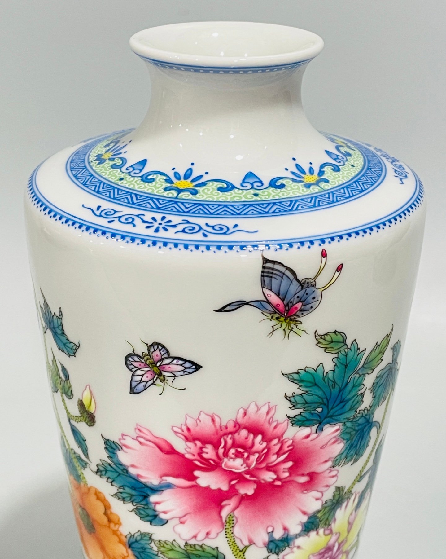 Qing Dynasty Yongzheng enamel butterfly and plum vase