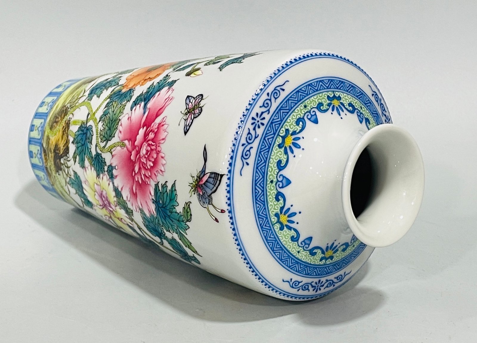 Qing Dynasty Yongzheng enamel butterfly and plum vase