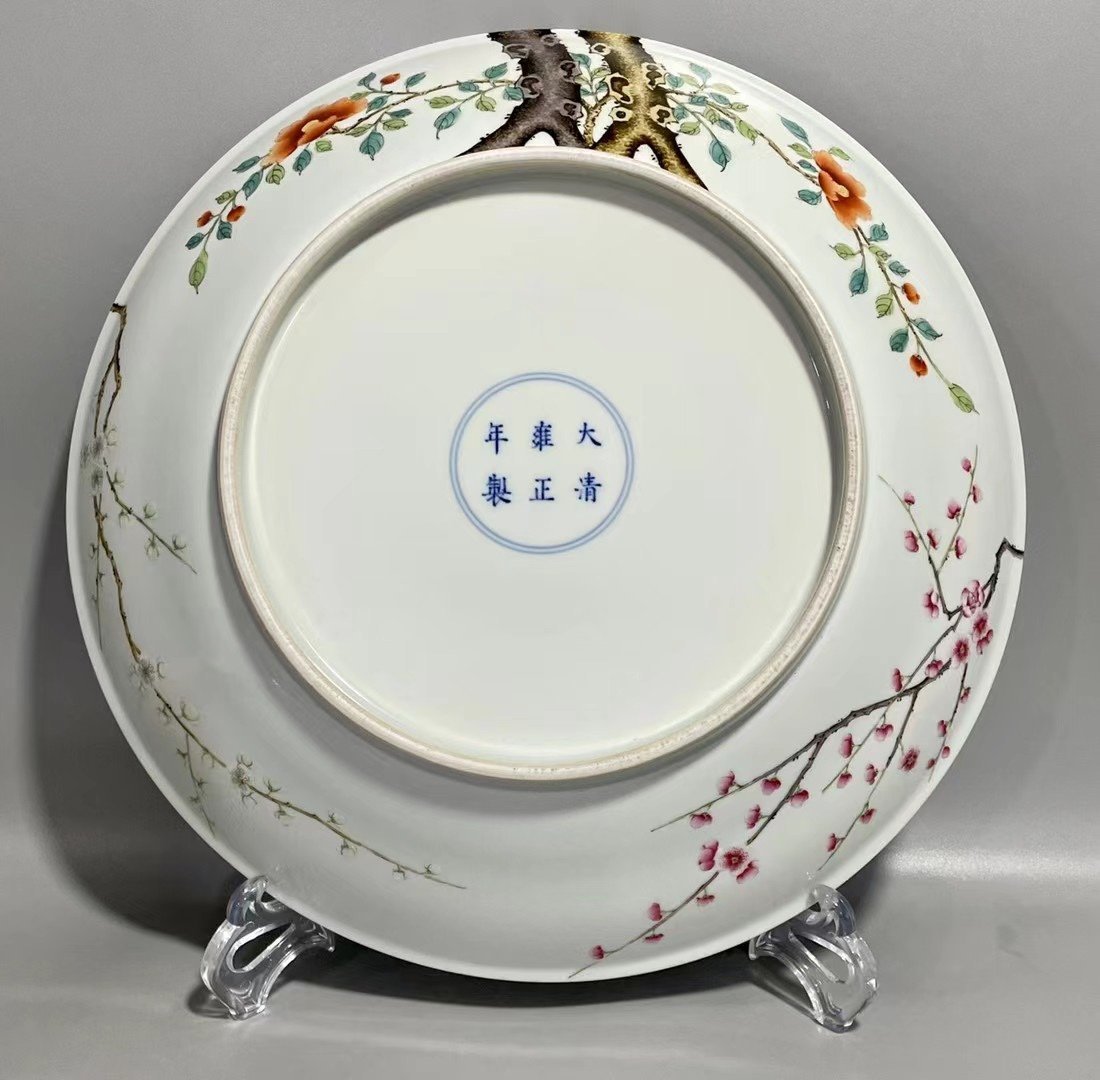 Qing Dynasty Yongzheng pastel paintings of flowers and birds on a branch plate