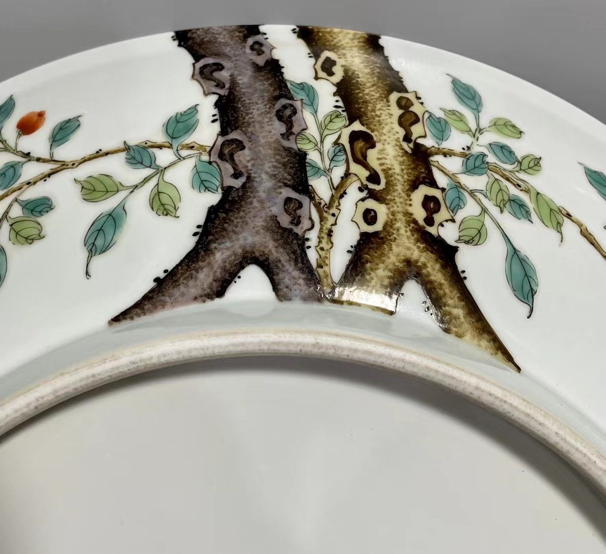 Qing Dynasty Yongzheng pastel paintings of flowers and birds on a branch plate