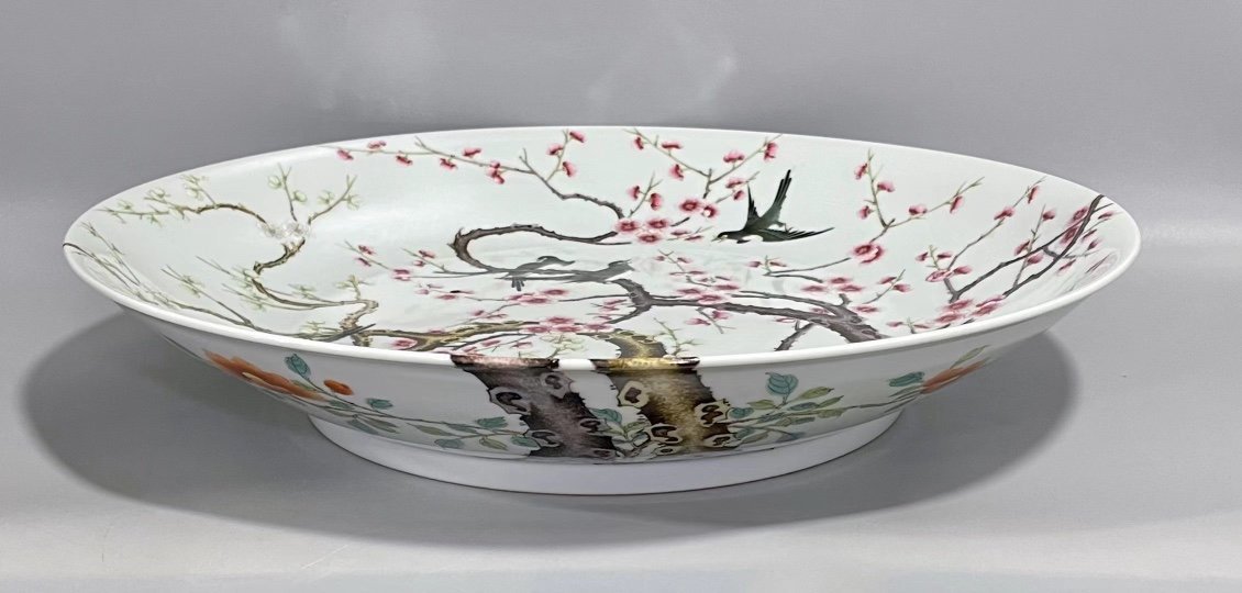 Qing Dynasty Yongzheng pastel paintings of flowers and birds on a branch plate