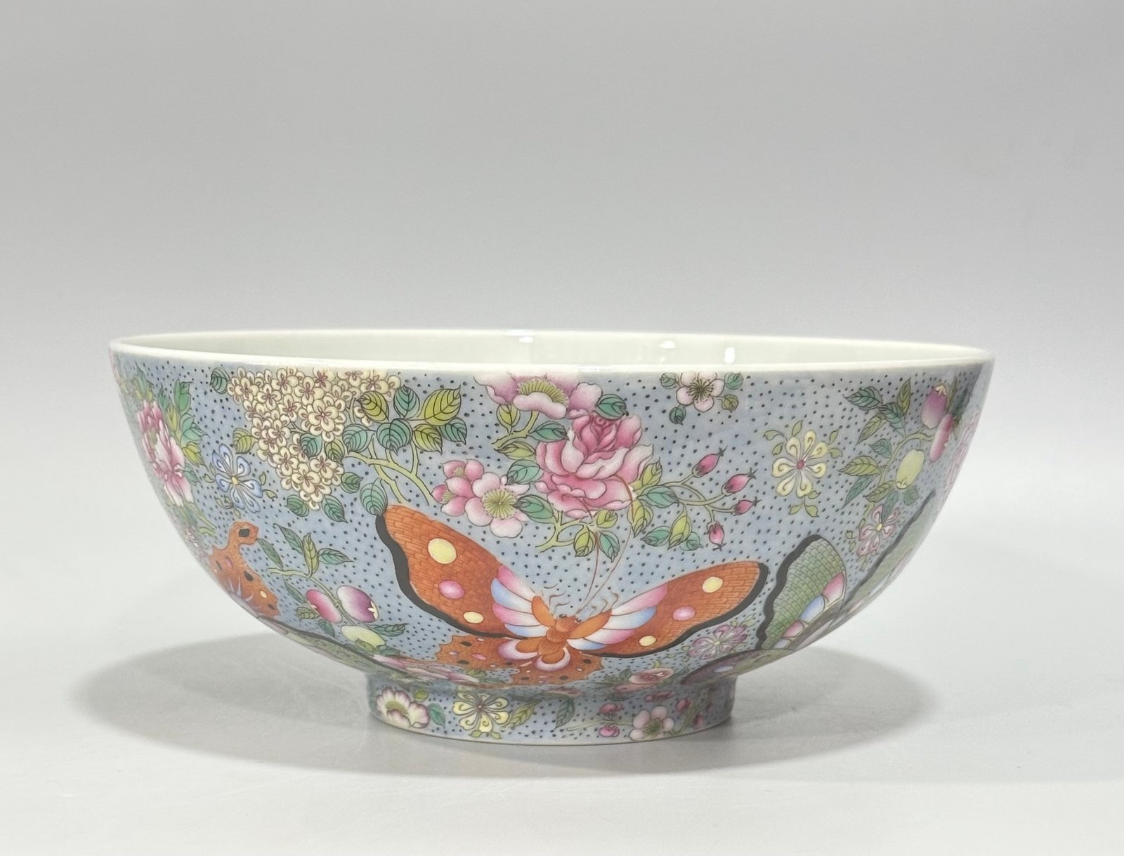 Qing Dynasty Yongzheng enamel bowl with split branches flowers and butterflies