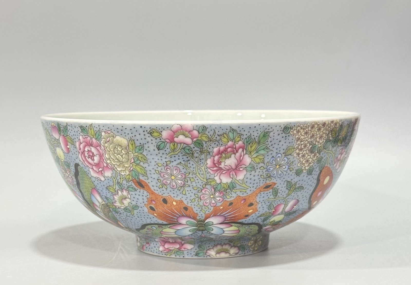 Qing Dynasty Yongzheng enamel bowl with split branches flowers and butterflies