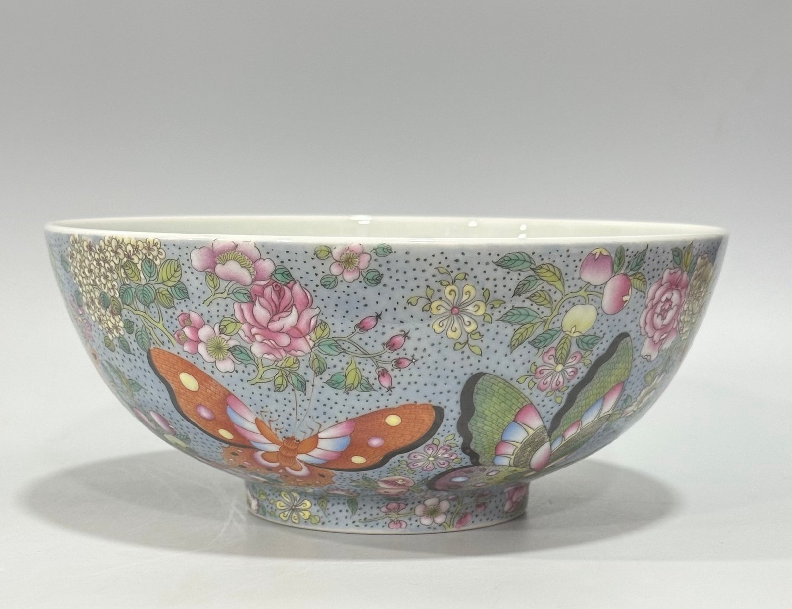 Qing Dynasty Yongzheng enamel bowl with split branches flowers and butterflies