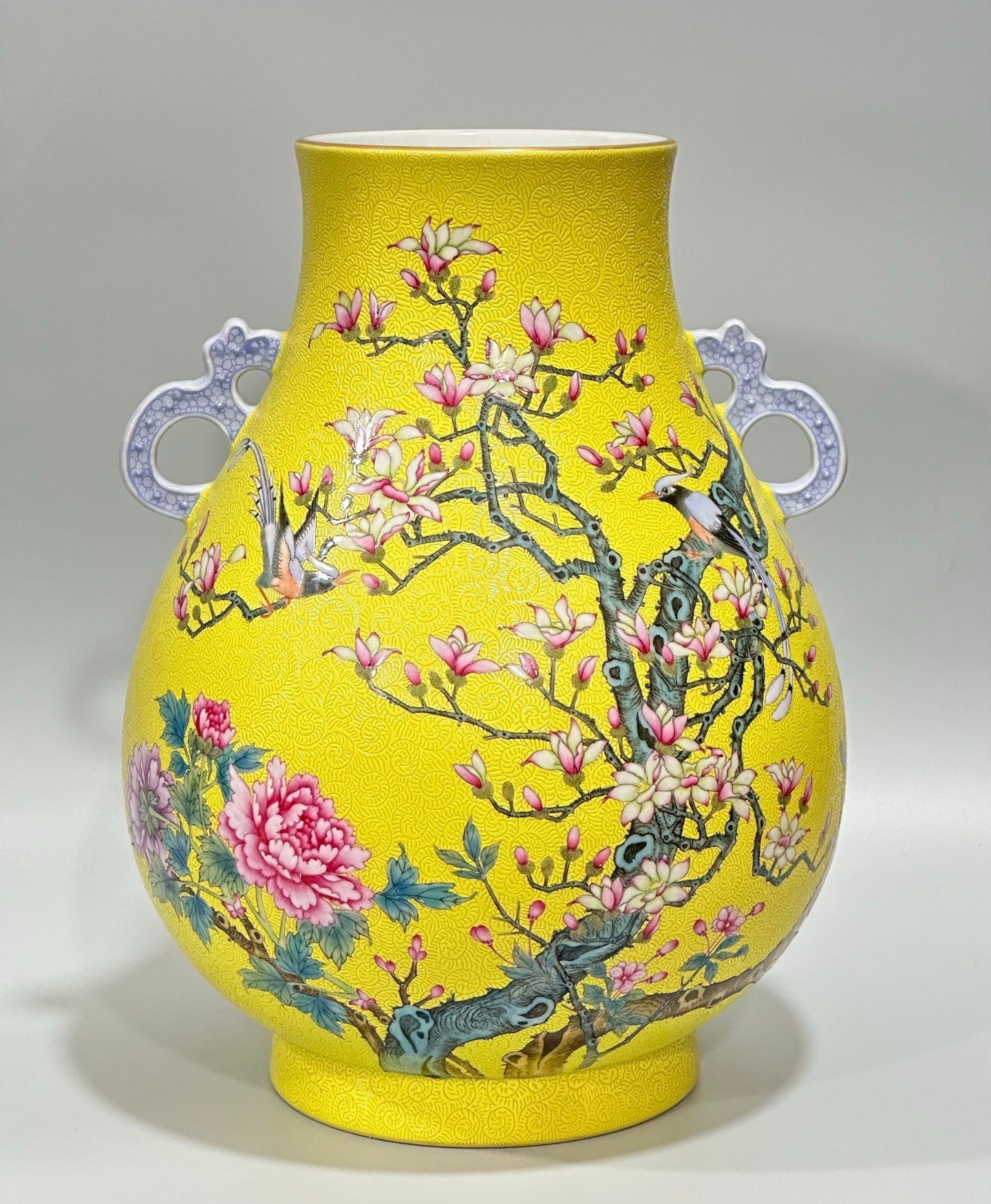 Qing Dynasty Yongzheng Enamel lemon yellow glaze orbital flower and bird poetry double-eared statue