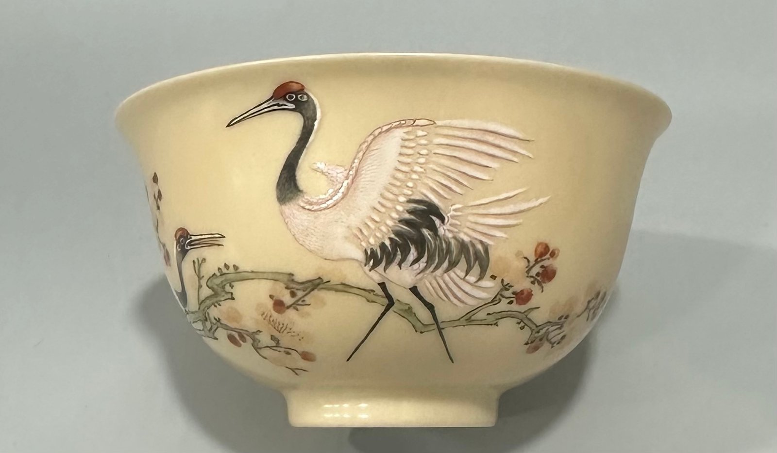Qing Dynasty Yongzheng Enamel beige-glazed cup with plum and crane patterns