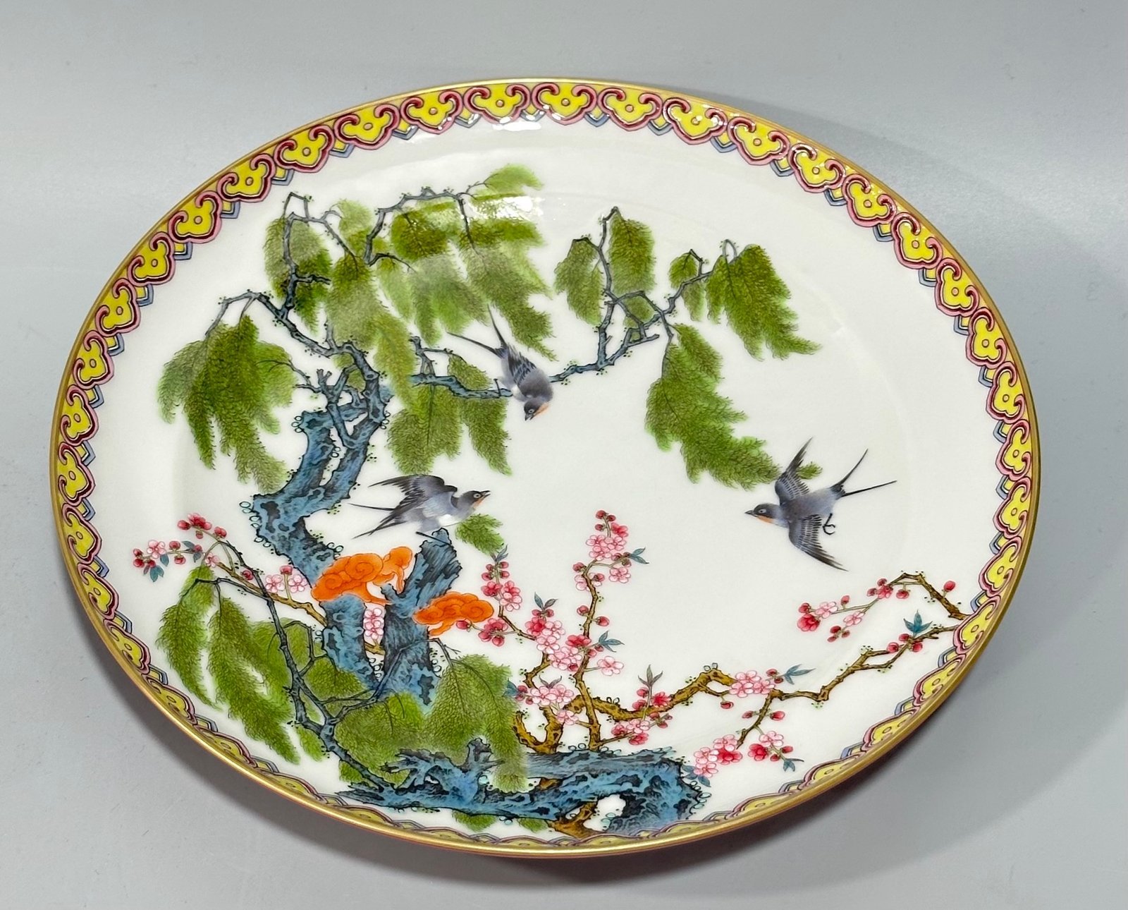Qing Dynasty Yongzheng Enamel and rouge red plate with flowers birds willows and swallows on the inside