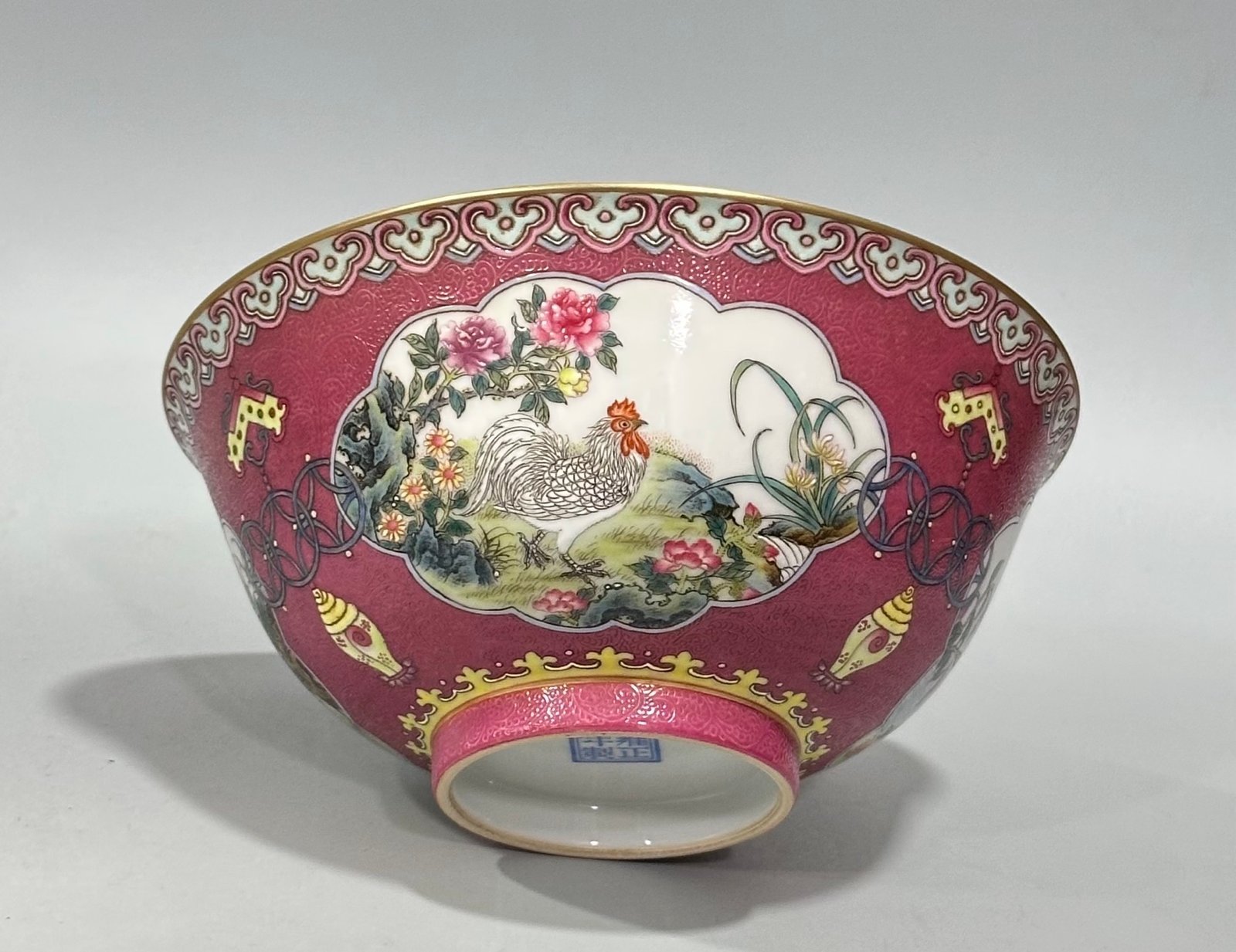 Qing Dynasty Yongzheng Enamel and rouge red orbital windowed bowl with flower and bird