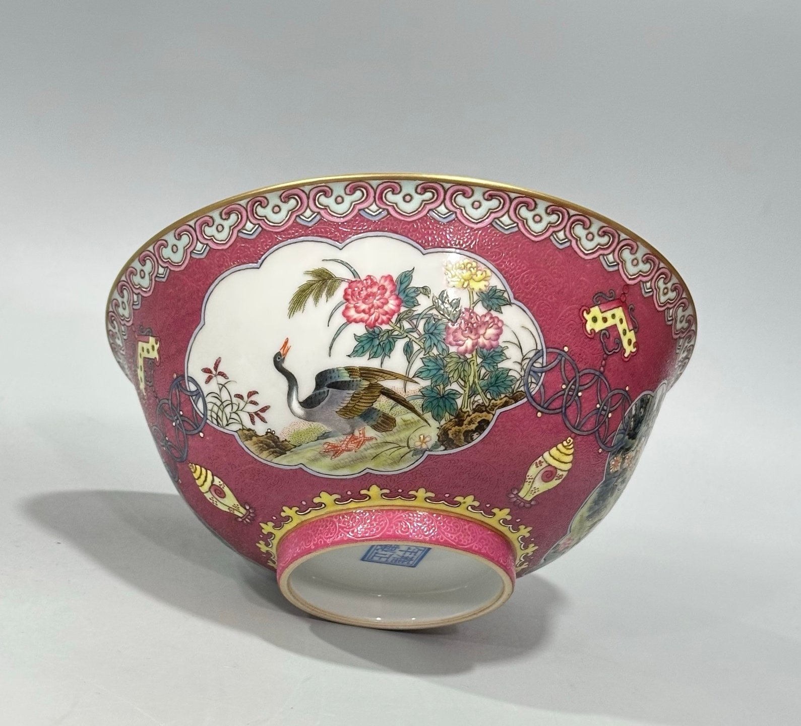 Qing Dynasty Yongzheng Enamel and rouge red orbital windowed bowl with flower and bird