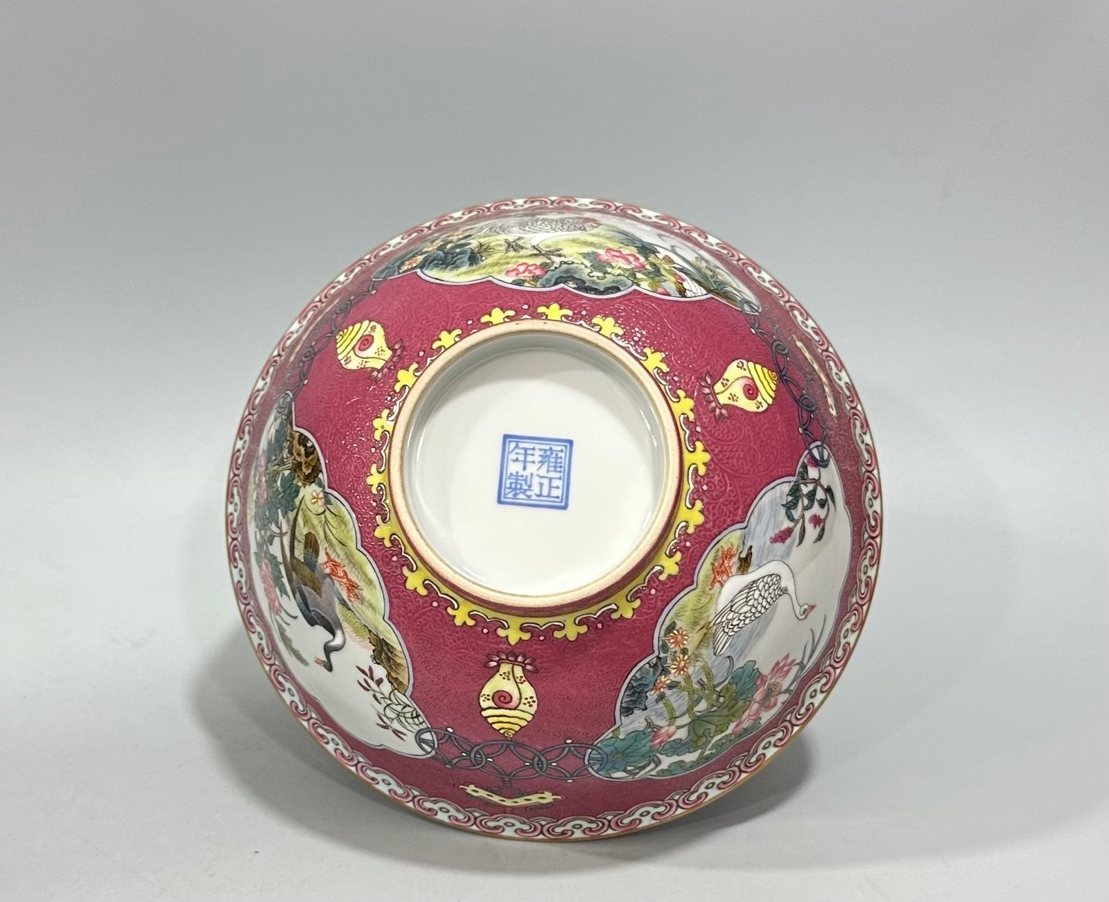 Qing Dynasty Yongzheng Enamel and rouge red orbital windowed bowl with flower and bird