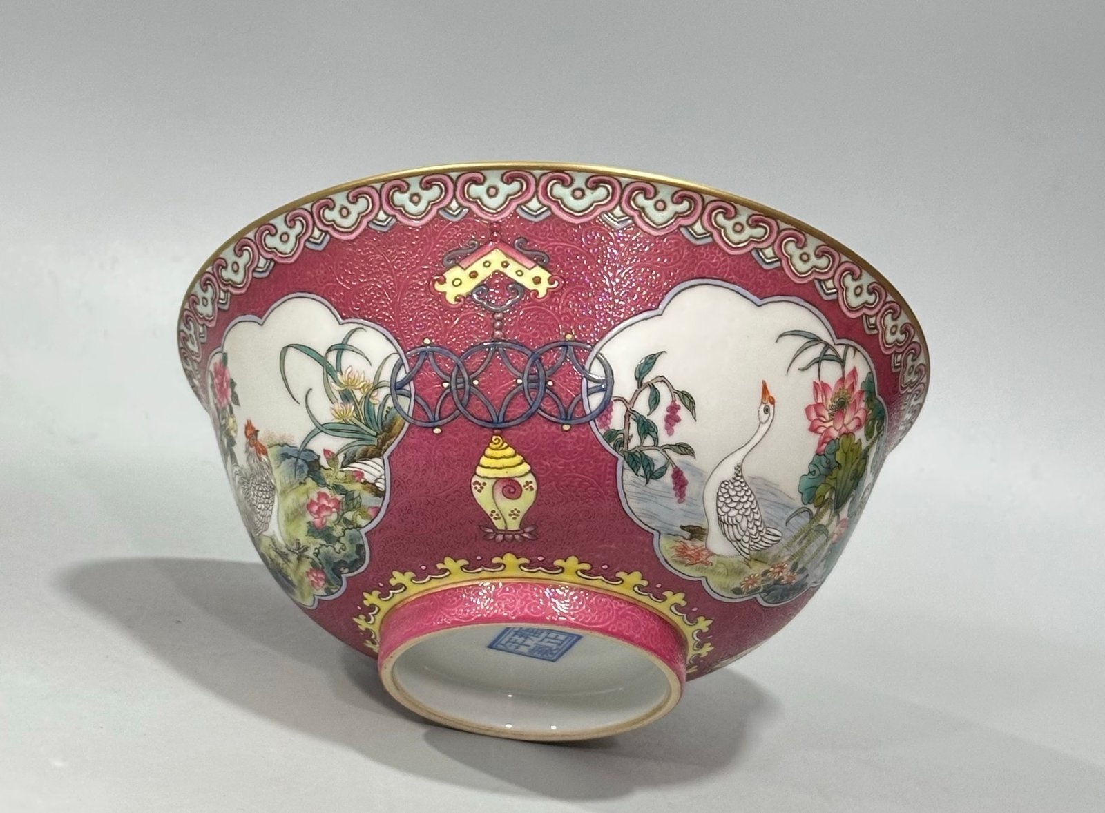 Qing Dynasty Yongzheng Enamel and rouge red orbital windowed bowl with flower and bird